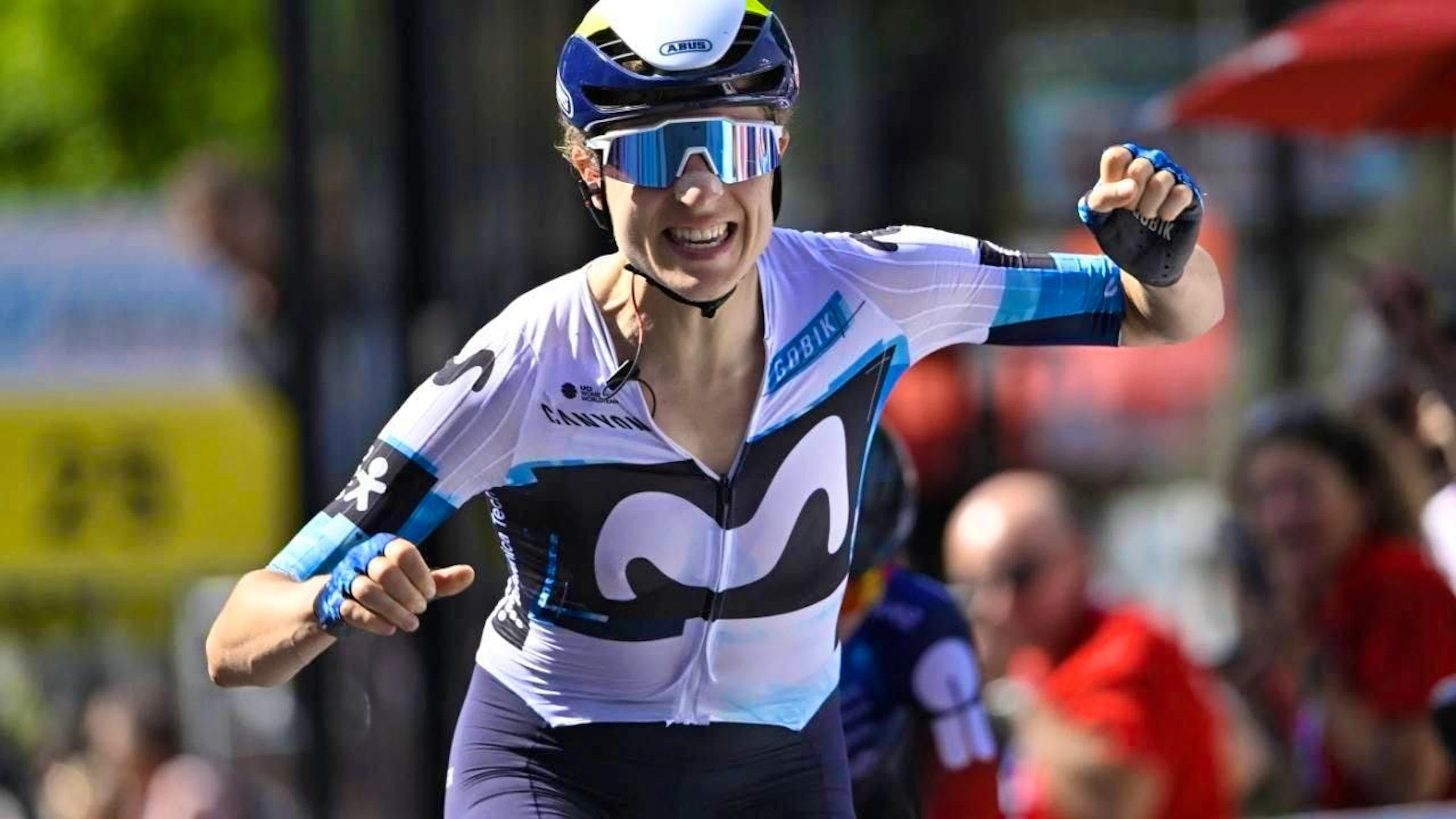 Marlen Reusser celebrates victory in the first stage of the Tour de Suisse in Gstaad.