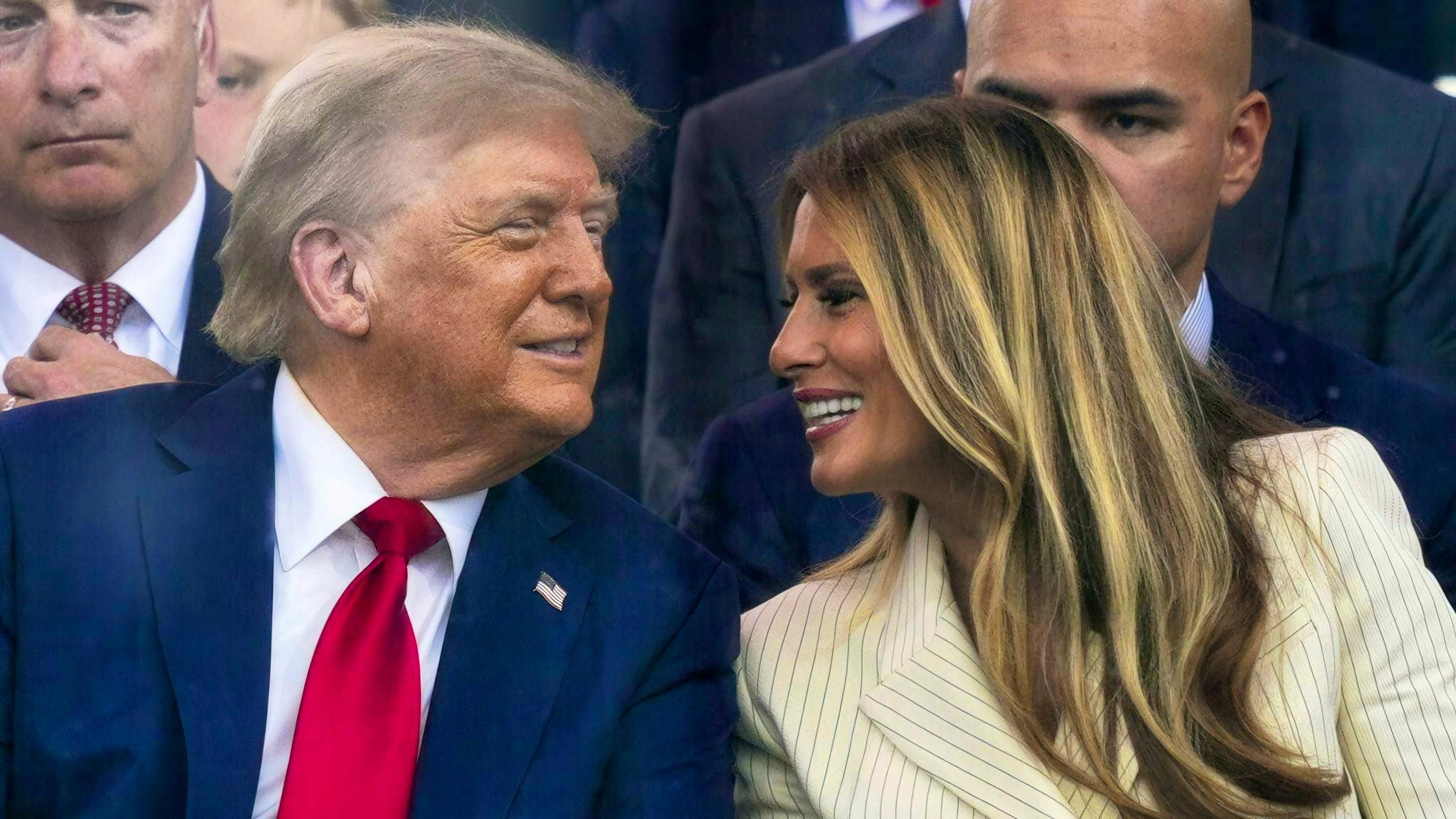 Trump and his wife Melania smile at each other during the military parade. 