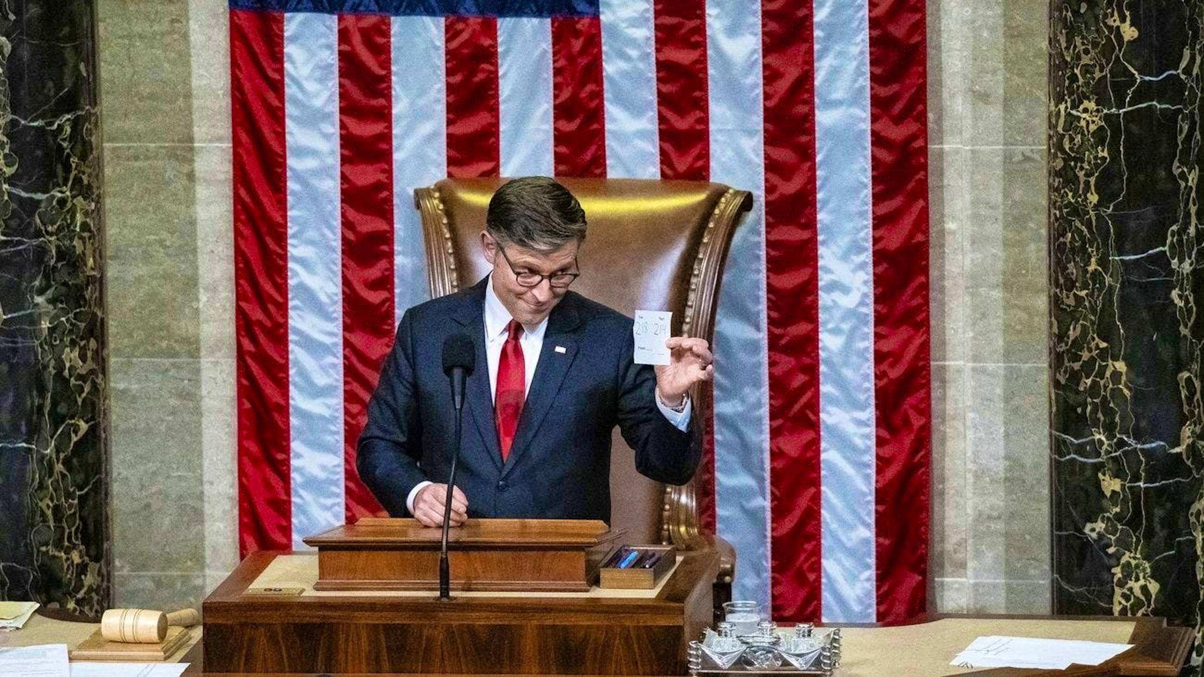 The Speaker of the House of Representatives, Mike Johnson, announces the final result of the vote.