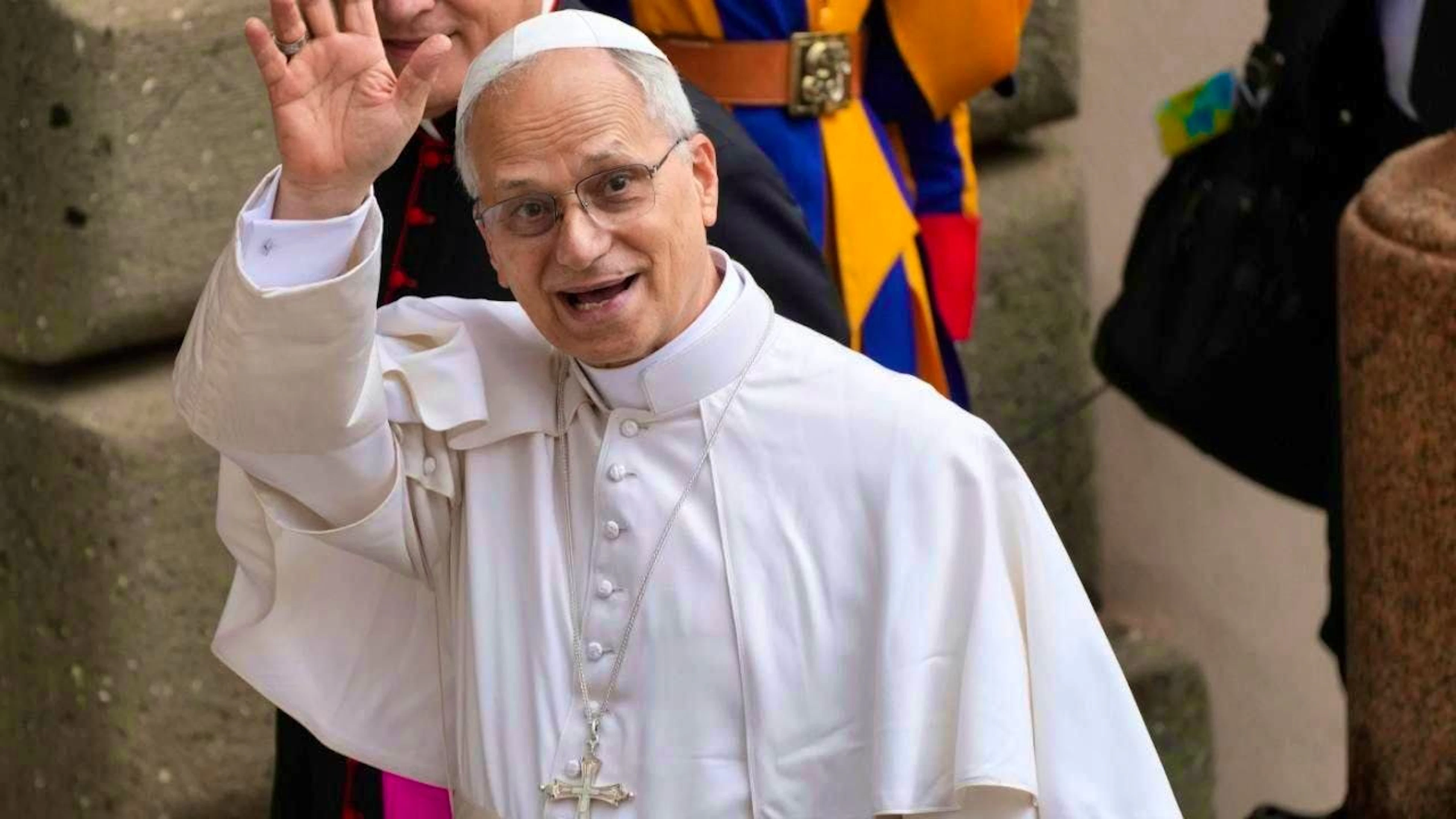 Pope Leo XIV leaves Castel Gandolfo at the end of the Angelus prayer and waves. Photo: Gregorio Borgia/AP/dpa