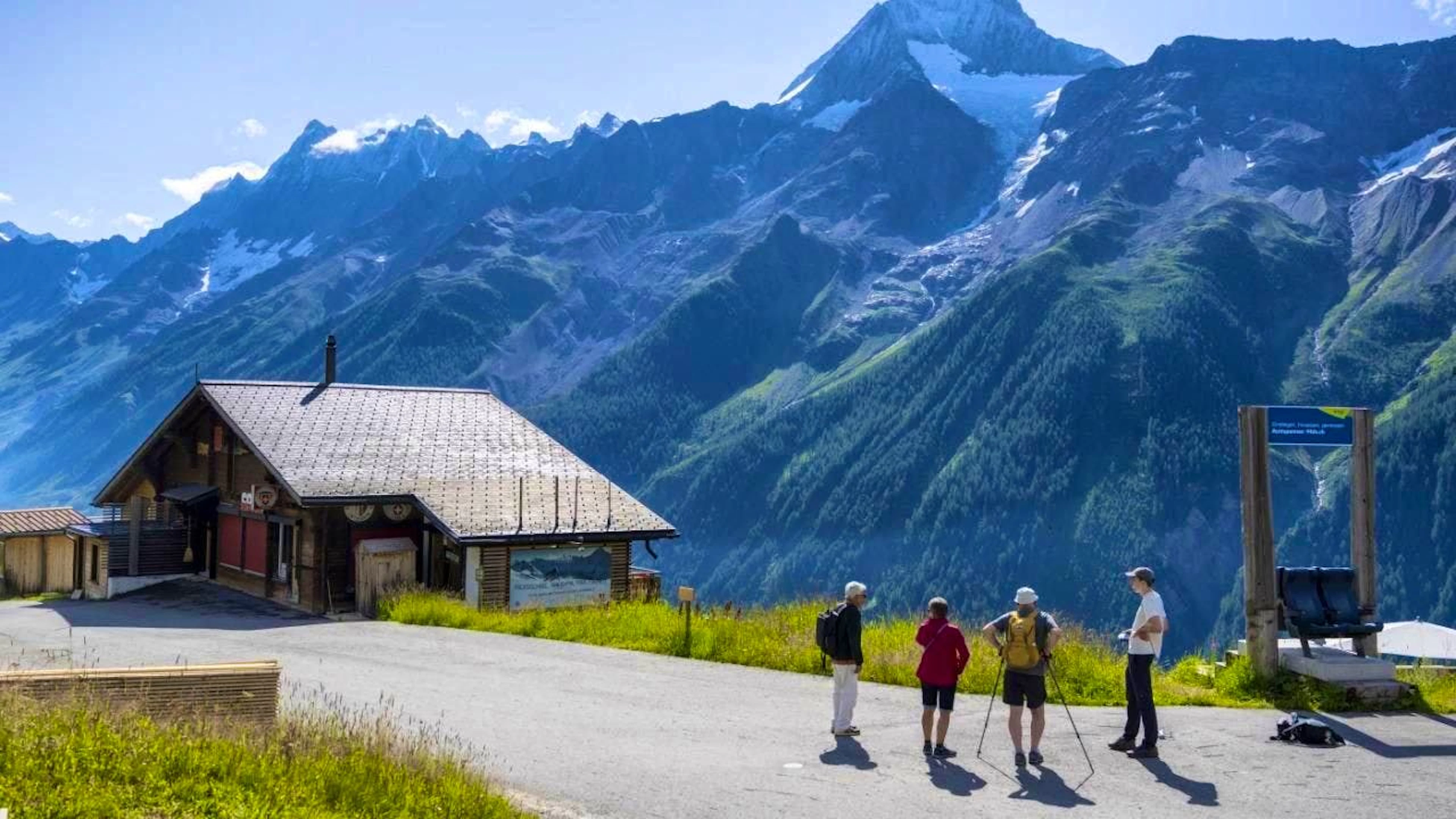 Hikers enjoy the view of the Bietschhorn from Lauchernalp.