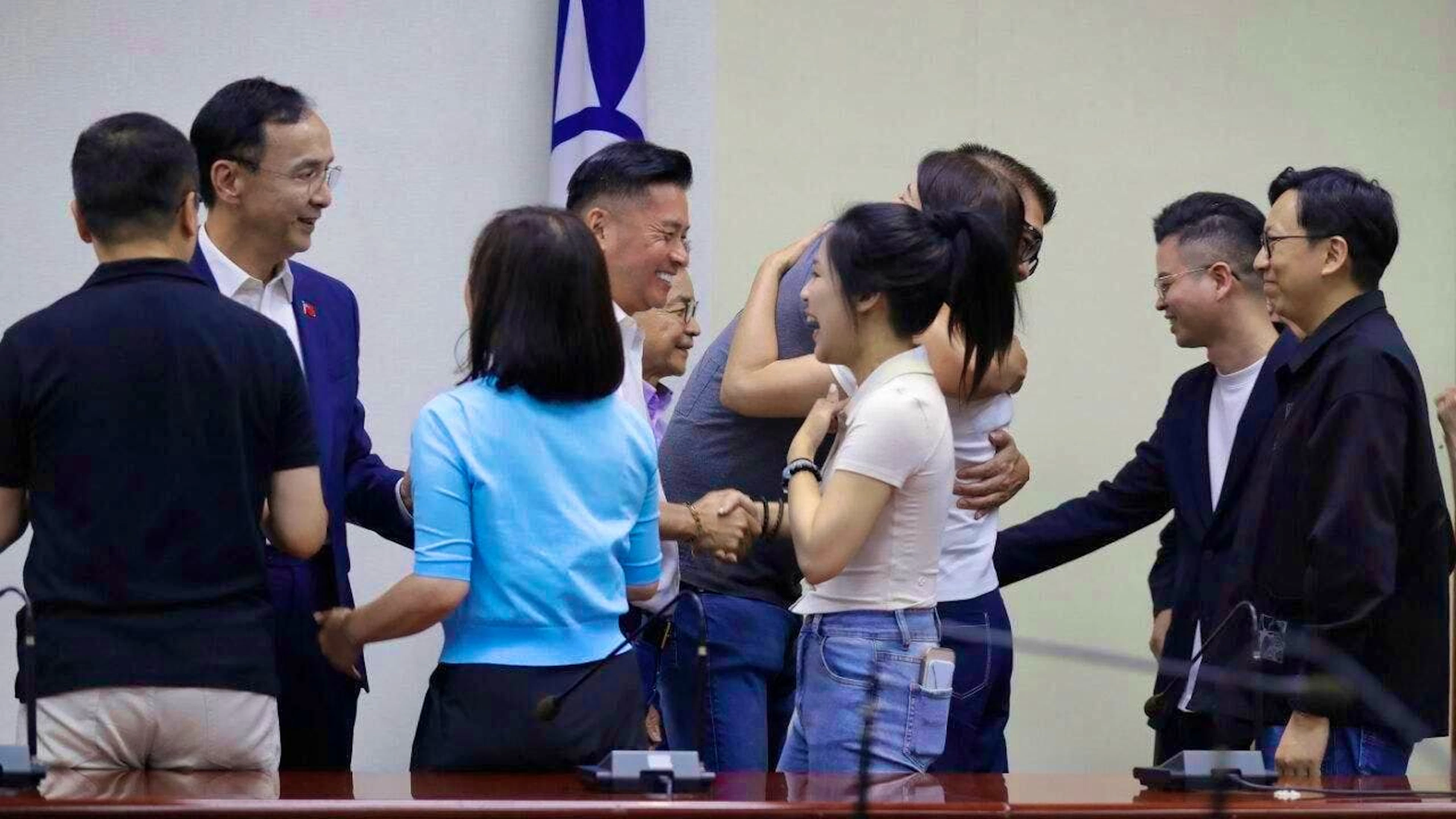 Members of the opposition Nationalist Party of Taiwan and party workers cheer after a press conference. 24 MPs from the opposition Nationalist Party have to face a recall election in Taiwan. Photo: ChiangYing-ying/AP/dpa