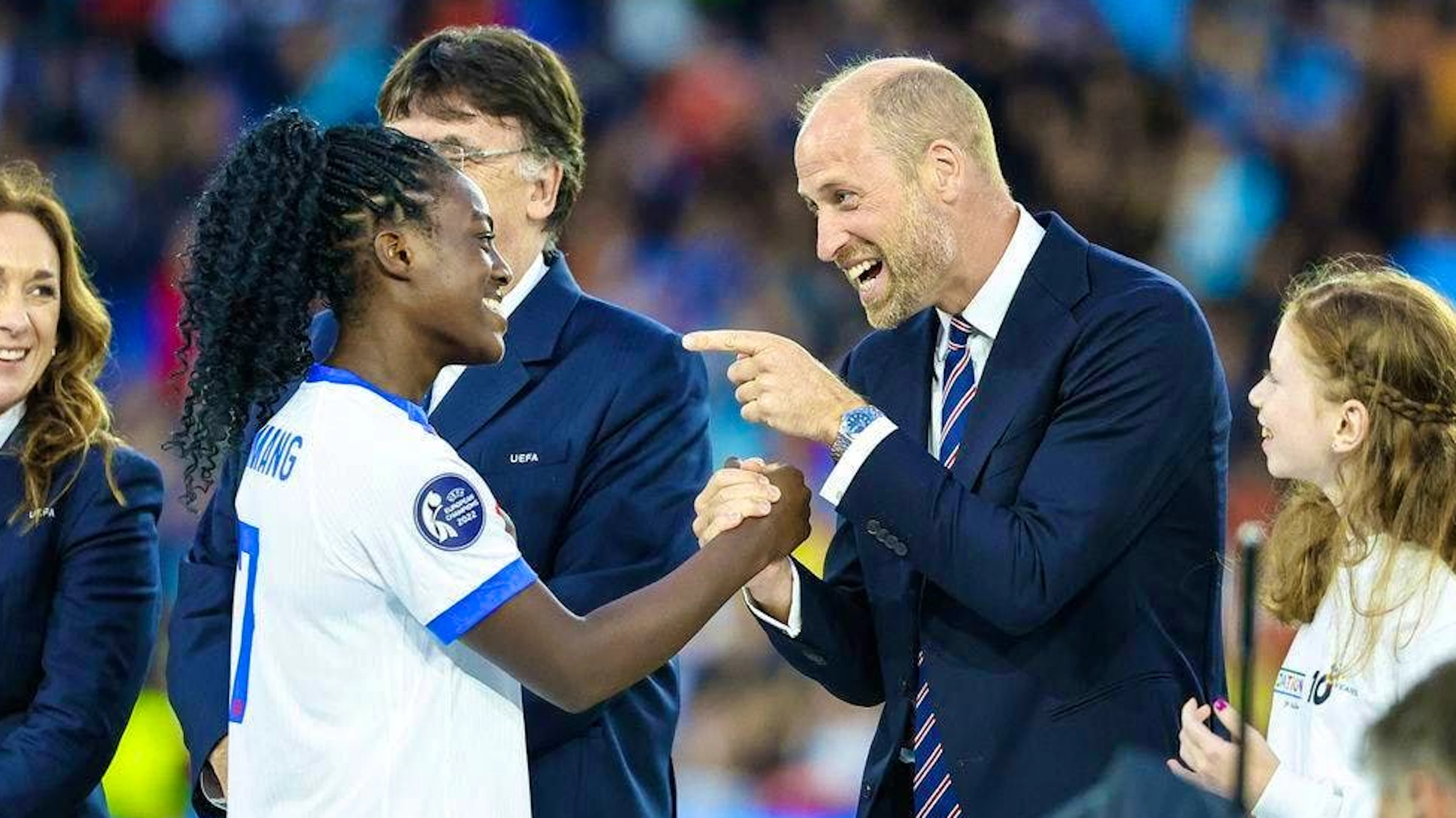 Prince William congratulates Michelle Agyemang on winning the European Championship title.