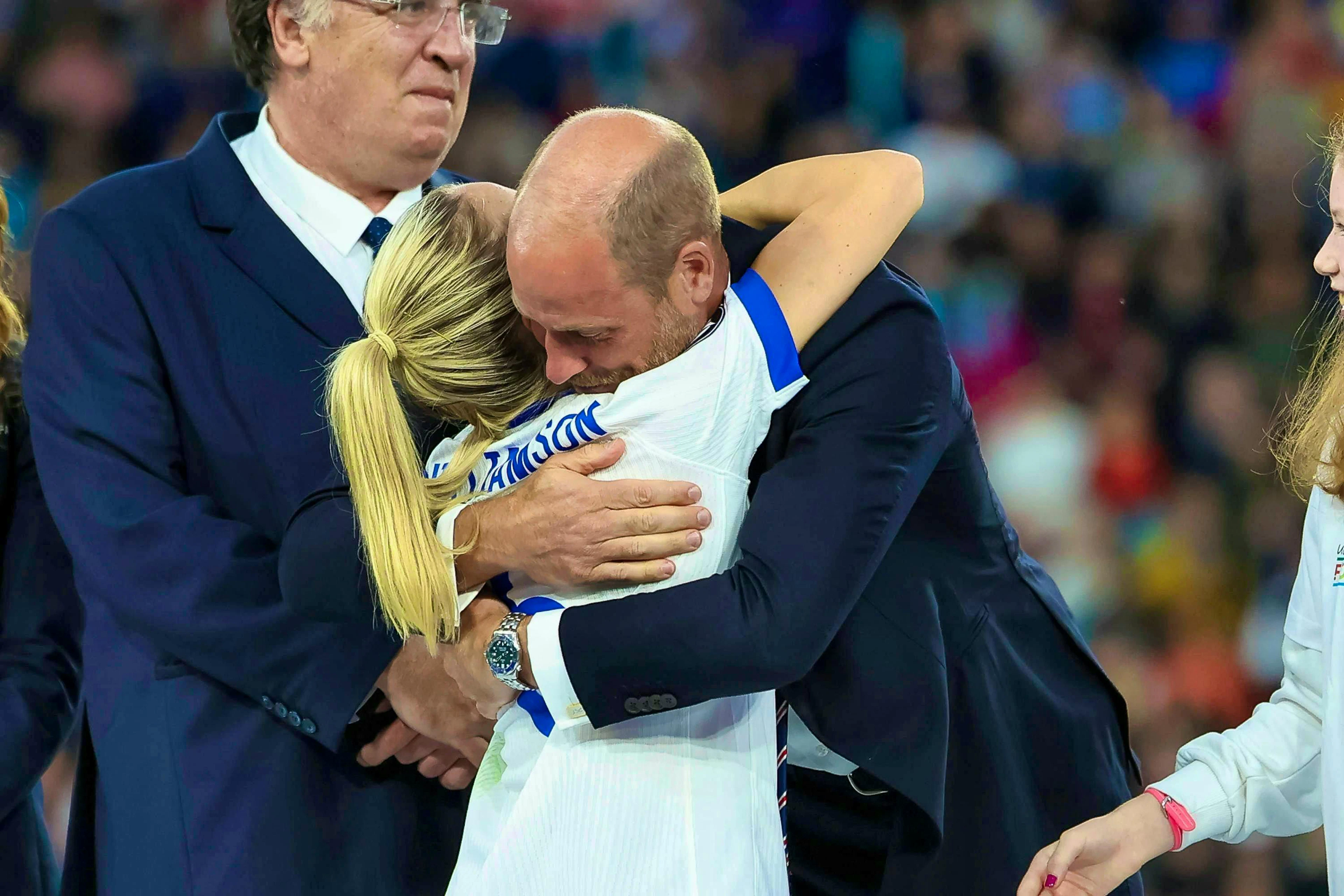 Prince William hugs England player Leah Williamson at the award ceremony.