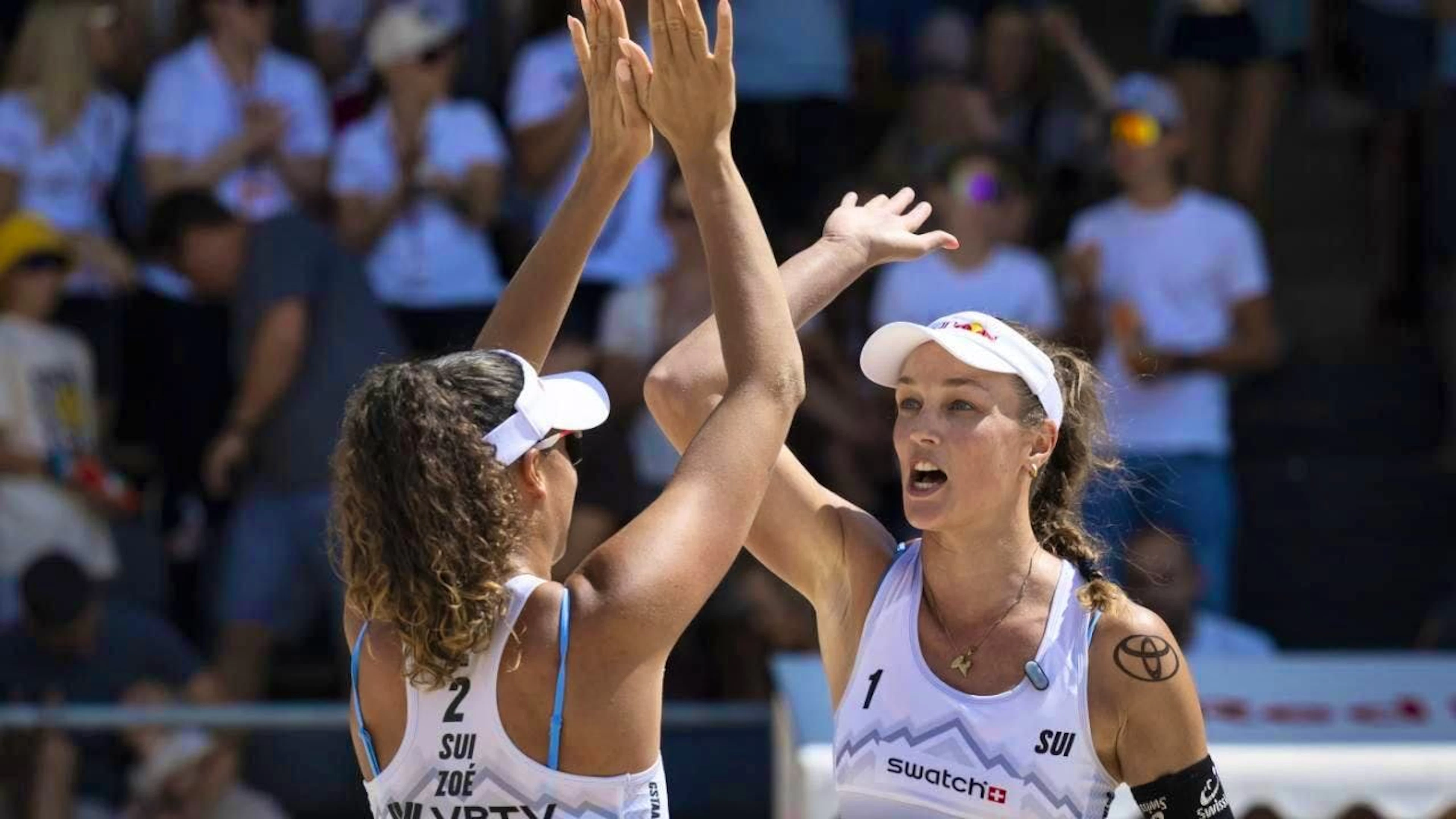 Done: Zoé (left) and Anouk Vergé-Dépré also win their second group match at the European Championships in Düsseldorf