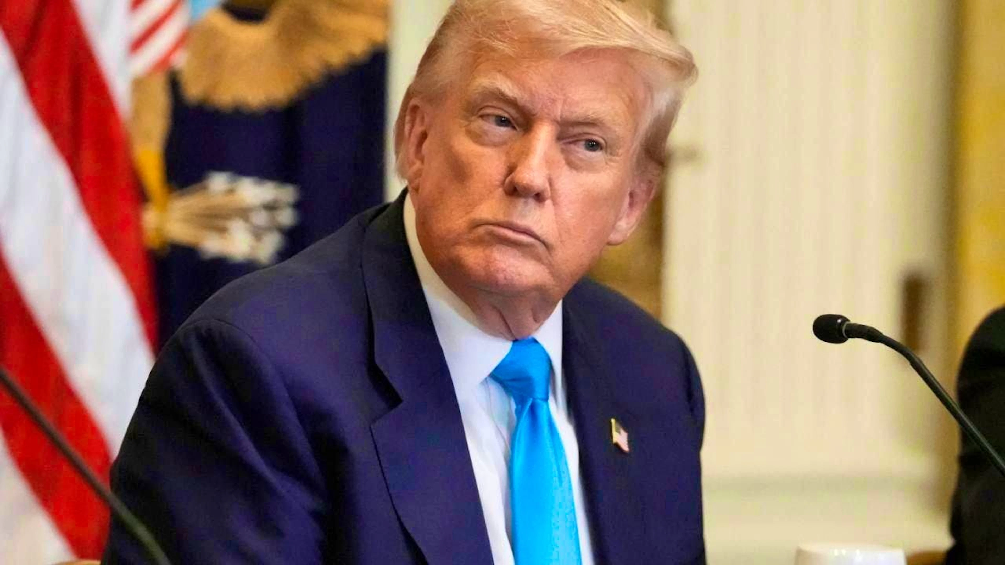 US President Donald Trump listens at an event in the East Room of the White House. Photo: Mark Schiefelbein/AP/dpa