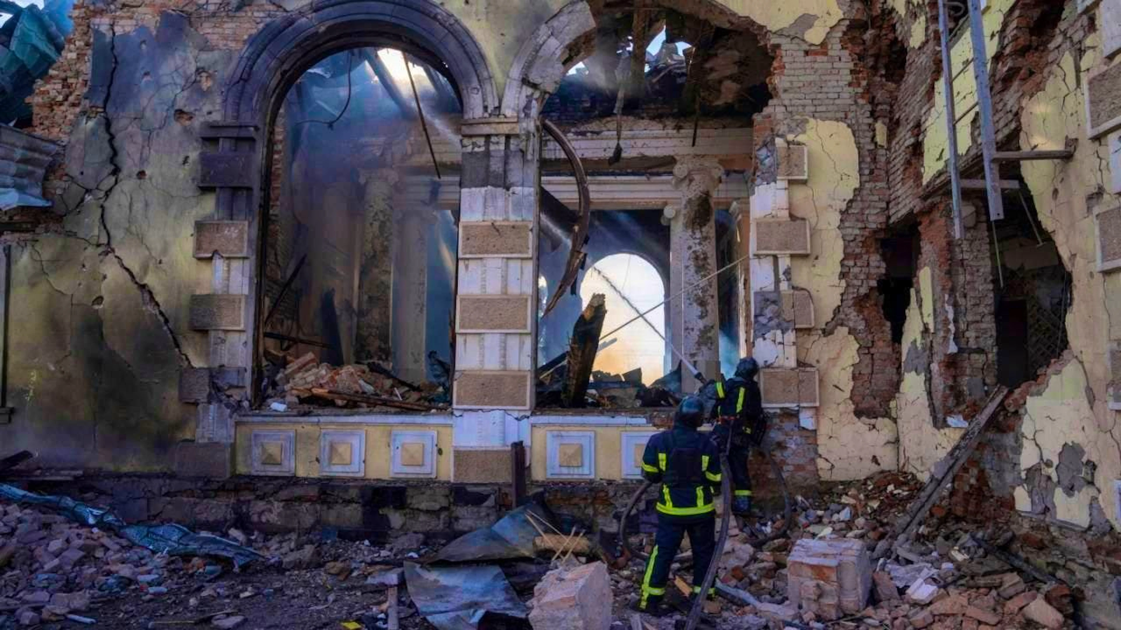 ARCHIVE - Firefighters extinguish the fire in a train station after a Russian attack. Photo: Alex Babenko/AP/dpa