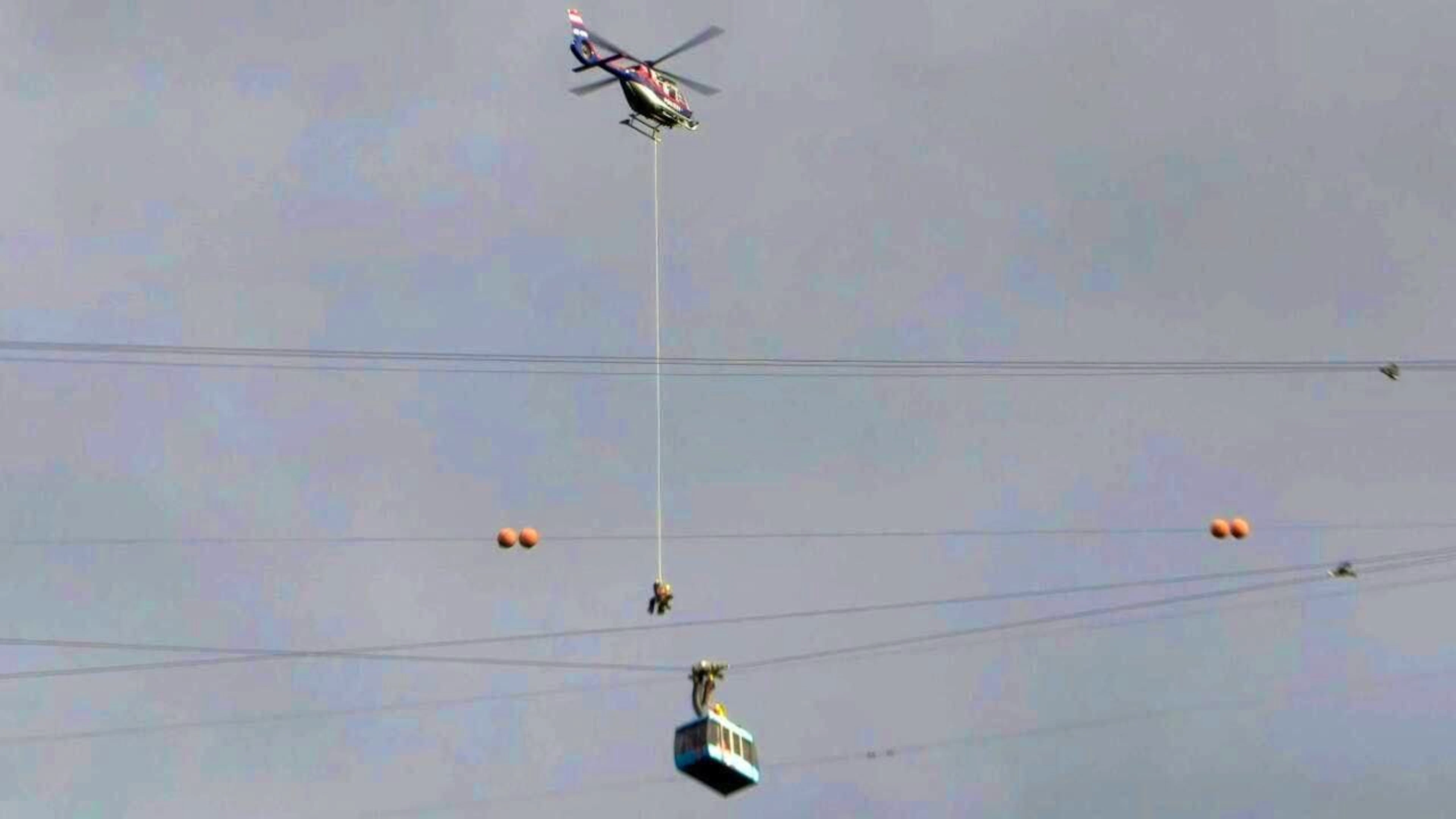 ARCHIVE - Passengers of the Dornbirn Karren cable car are rescued from the gondola by a helicopter. Photo: Maurice Shourot/APA/dpa