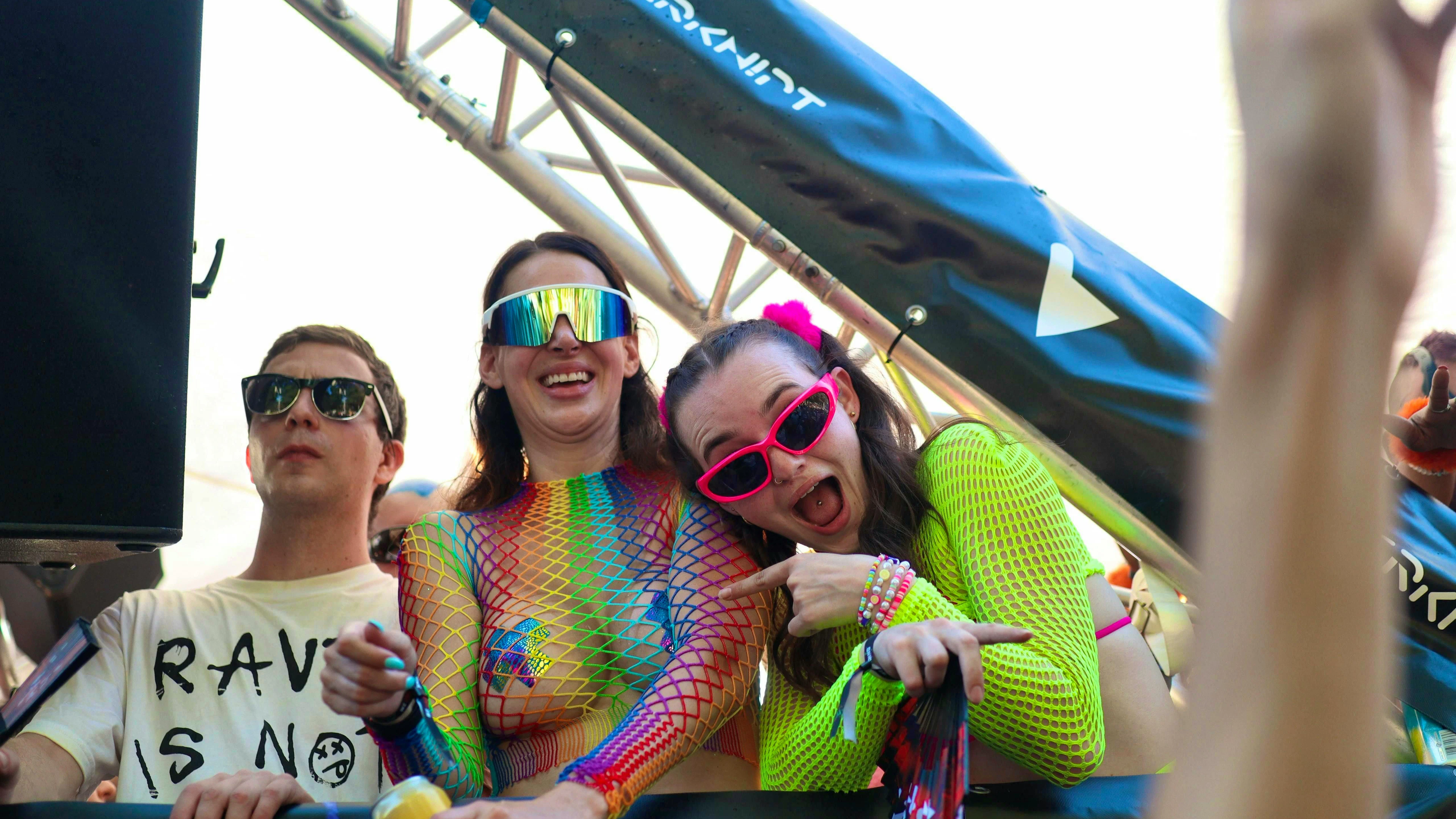Rainbow colors on skin and glasses.