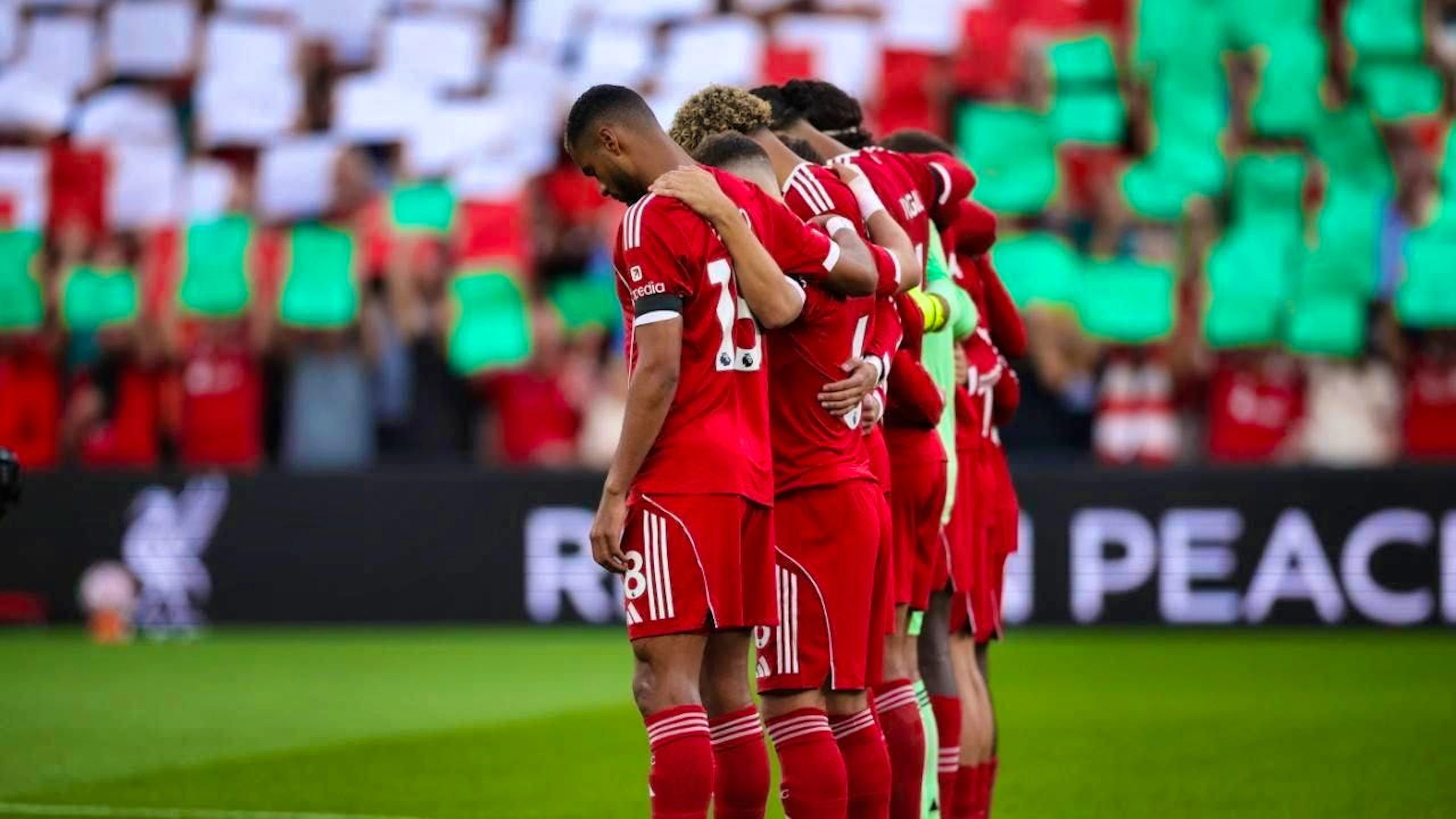 A minute's silence was held at Anfield before the opening game