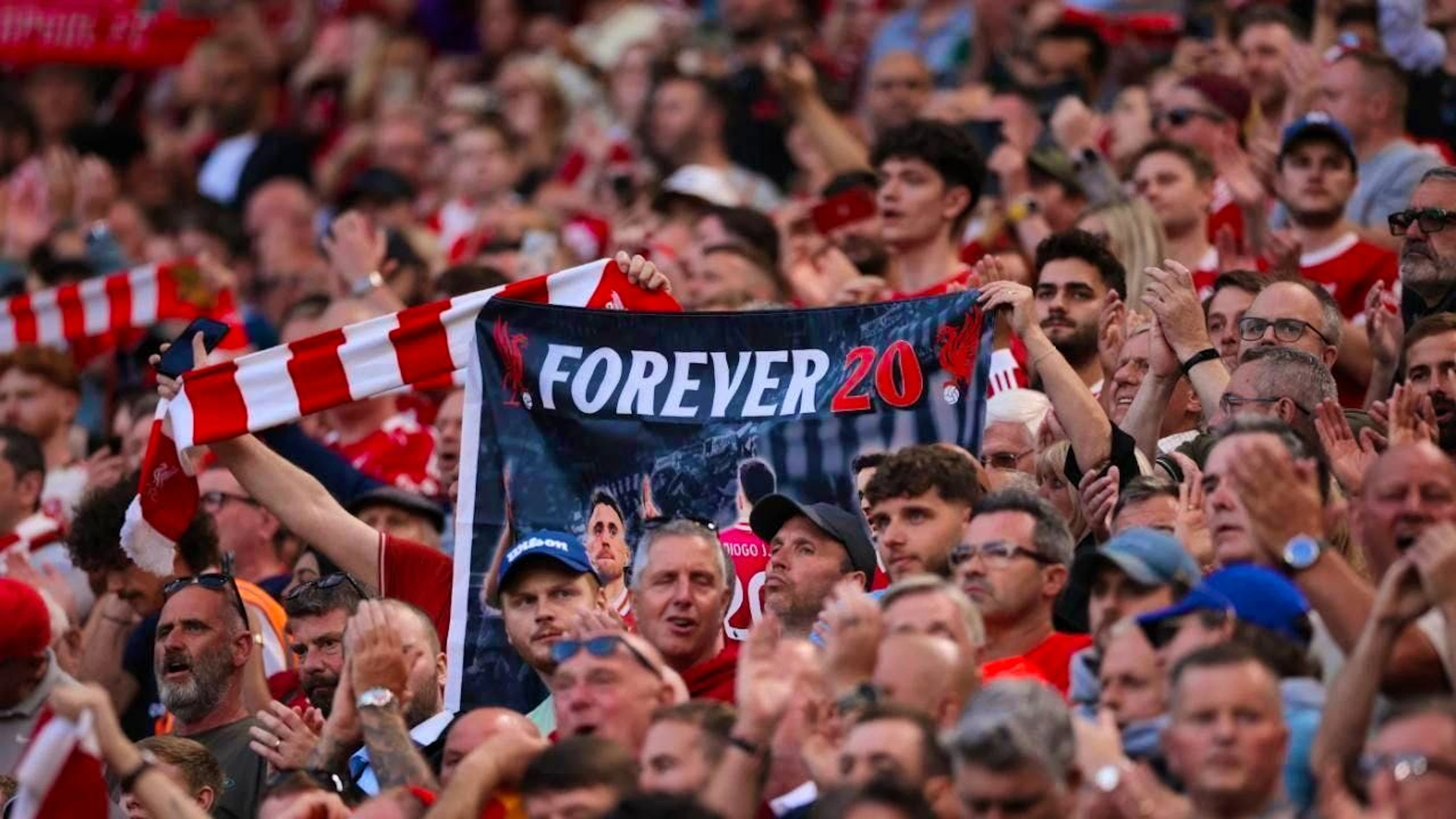 Numerous scarves, flags and banners with pictures and dedications to the two were on display