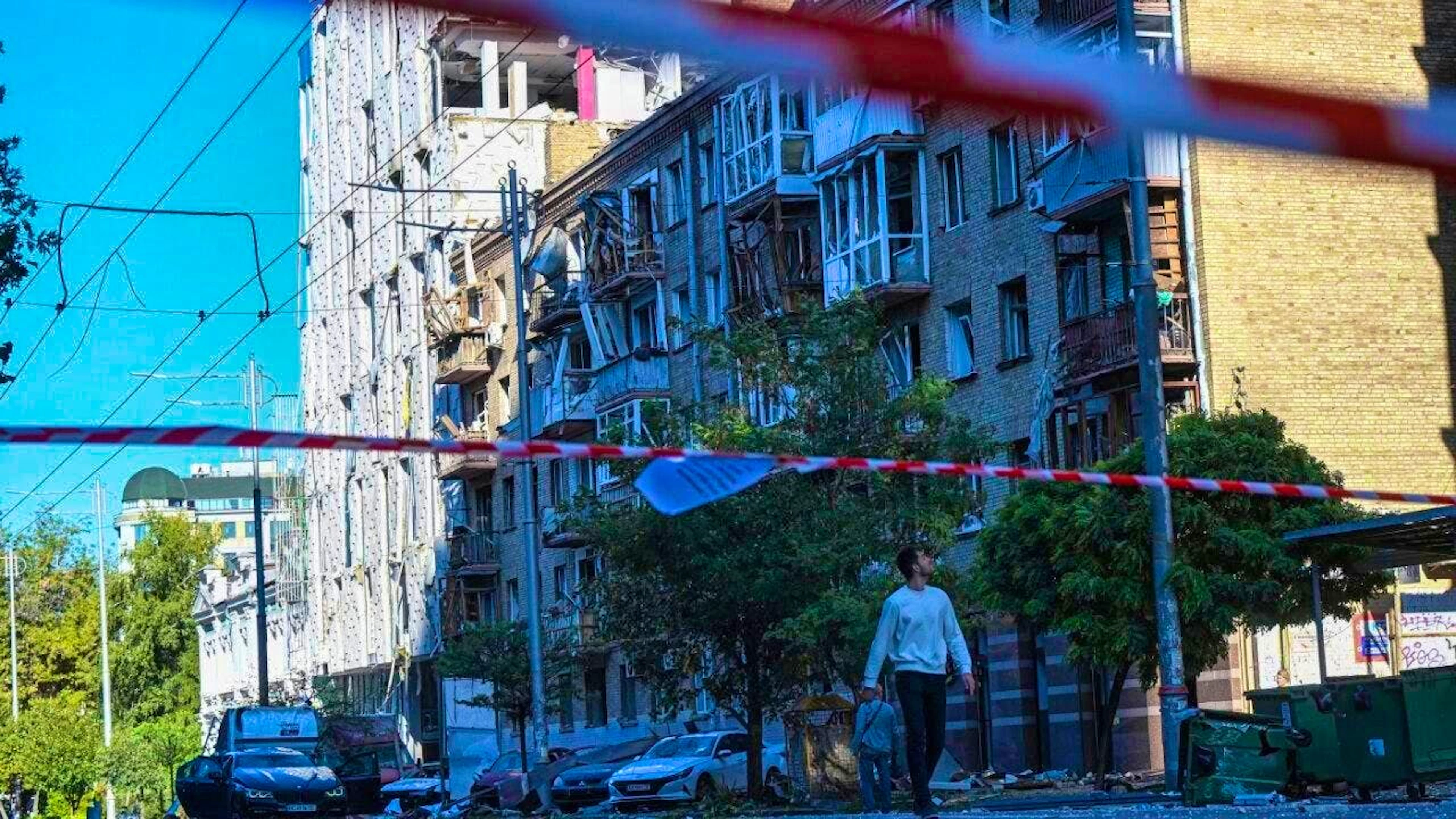 A man walks past damaged residential buildings in the center of the capital after a Russian drone and missile attack. Photo: Danylo Antoniuk/AP/dpa