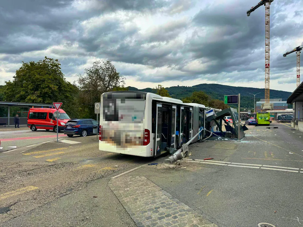 Car crashes into bus stop - three people injured