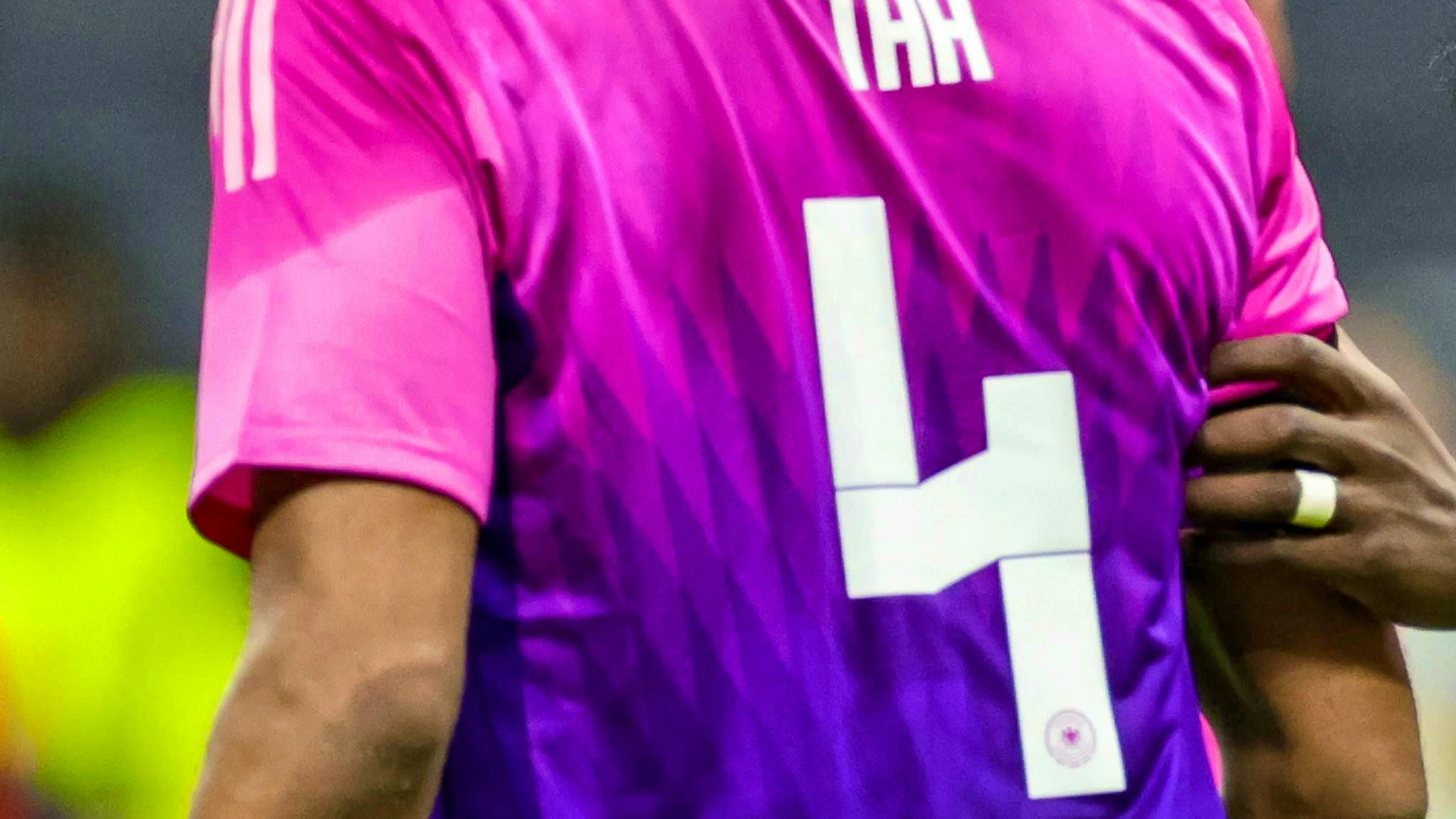 Germany's Jonathan Tah wears the Adidas jersey with the number 4 on the back.