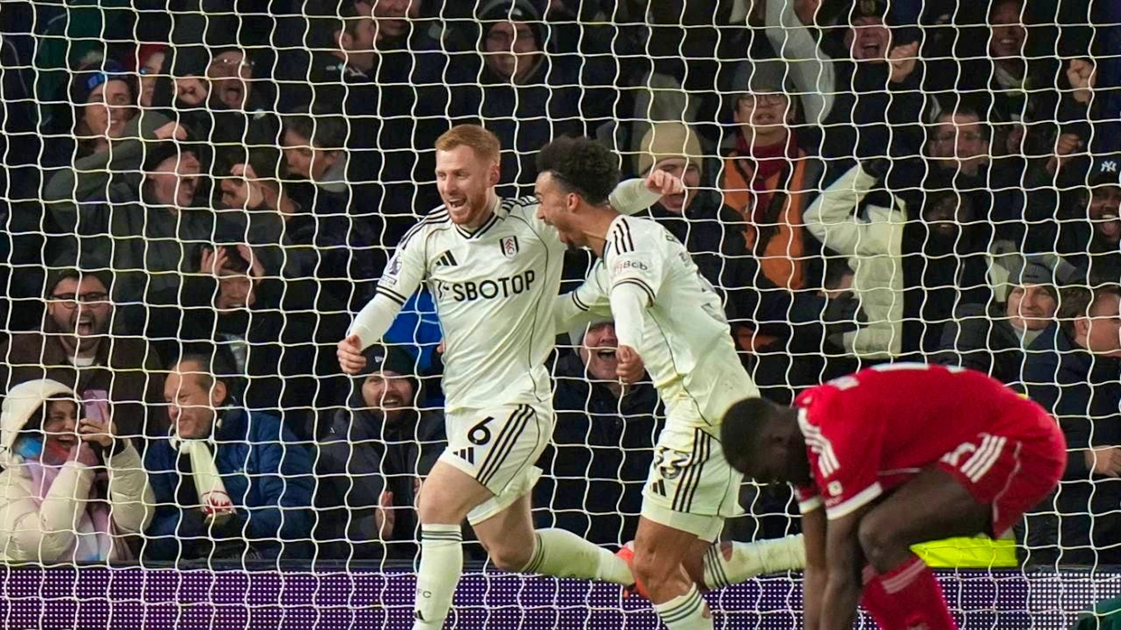 Fulham's Harrison Reed (left) celebrates his last-second equalizer against champions Liverpool