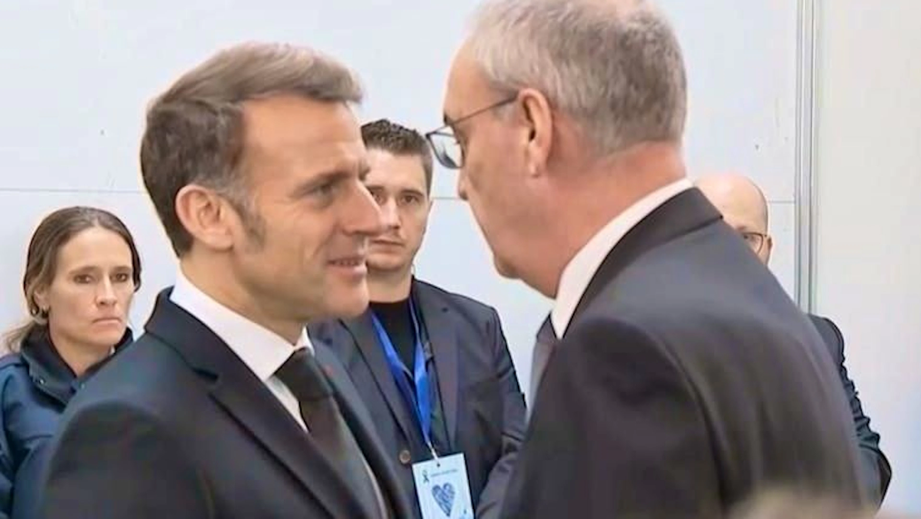French President Emmanuel Macron and President Guy Parmelin greet each other in Martigny.