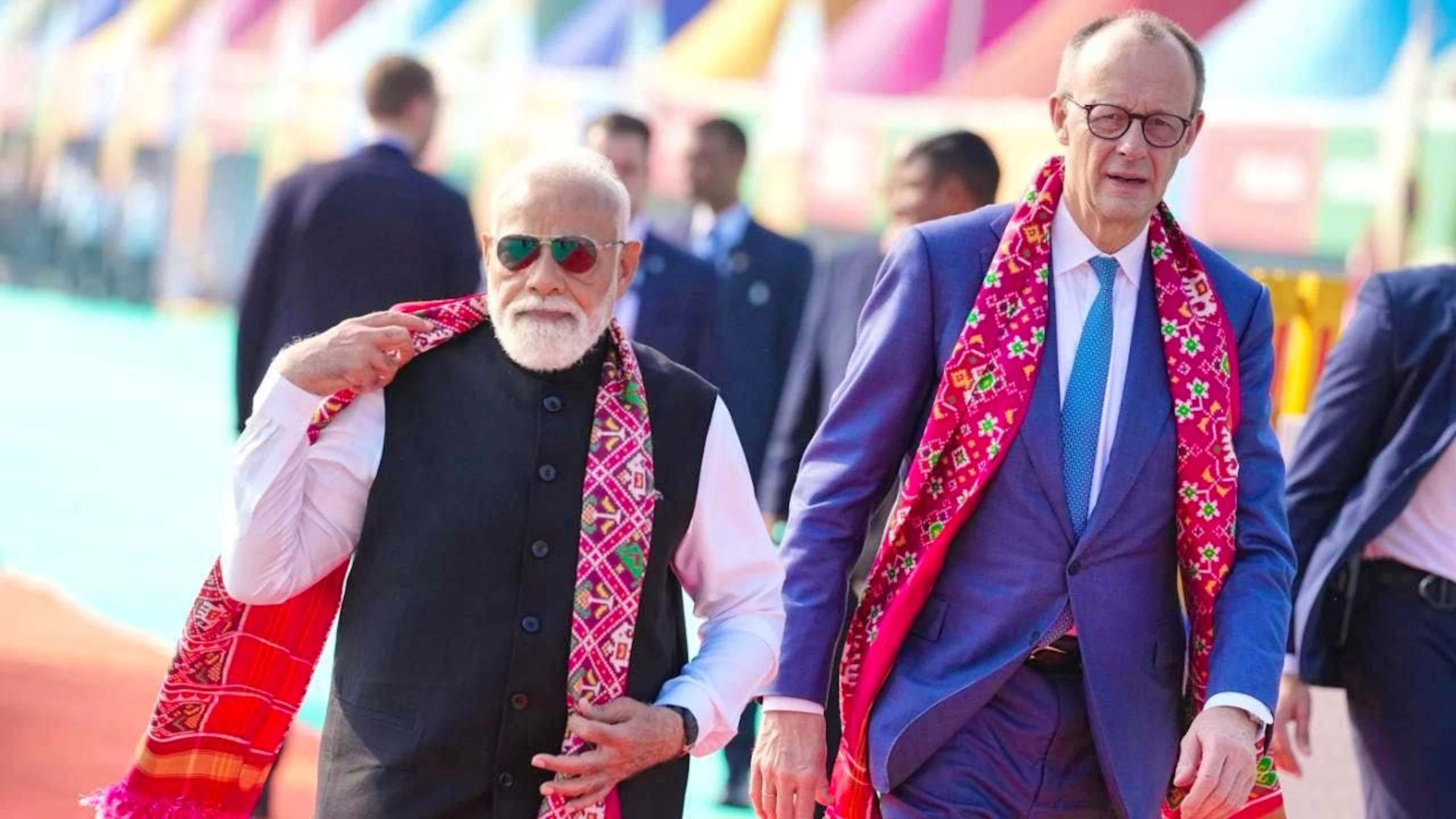 Narendra Modi (l), Prime Minister of India, and German Chancellor Friedrich Merz (CDU) visit a kite festival. It is the Chancellor's first major trip to Asia since taking office in May. Photo: Kay Nietfeld/dpa