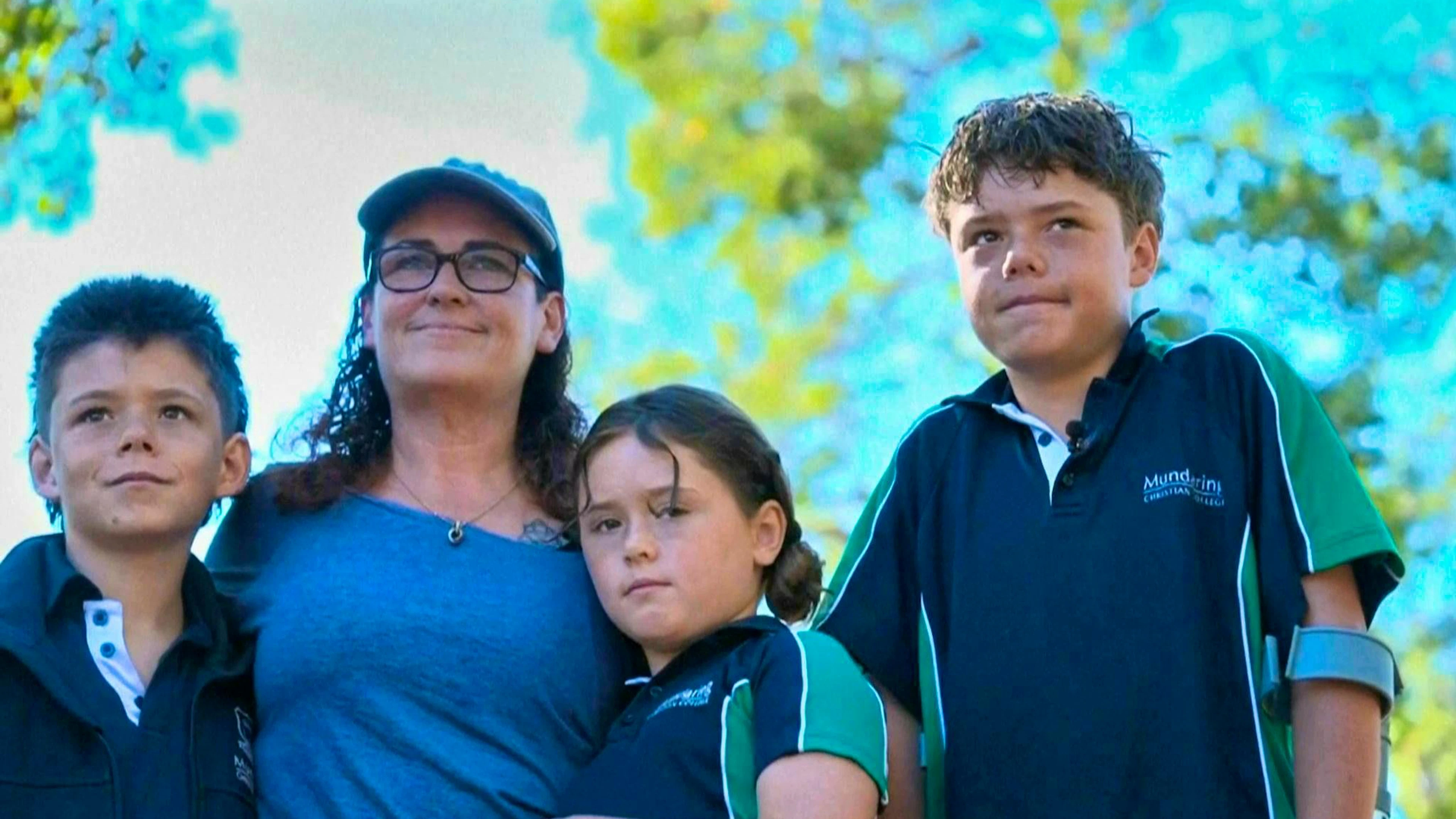 13-year-old Austin (right in photo) swam for around four hours to save his family.