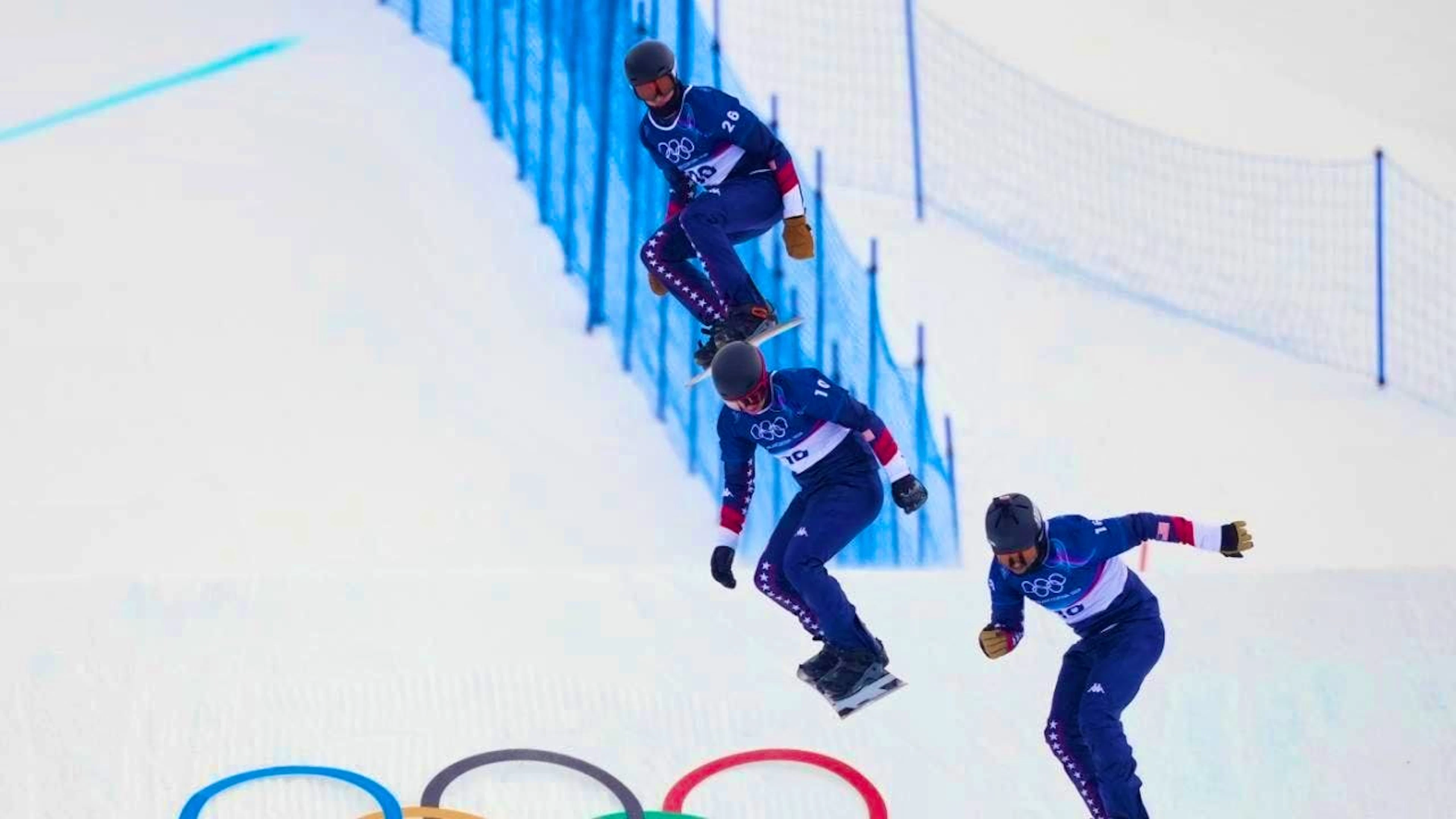 Nick Baumgartner (pictured below) during a training session at the Winter Games in Livigno with his teammates Cody Winters (top) and Nathan Pare. (archive picture)