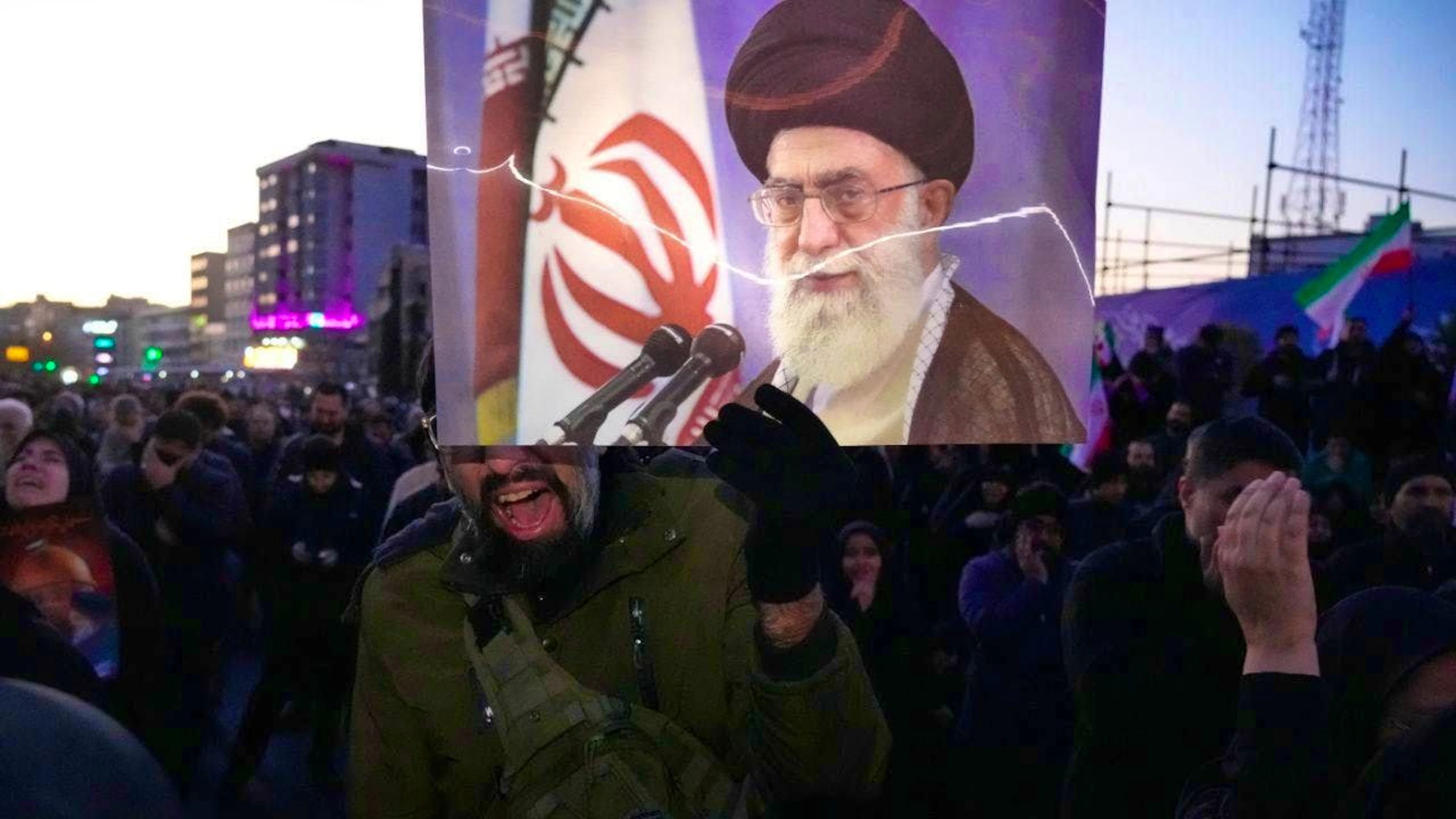 Government supporters mourn at a gathering in Tehran, Iran, after state television officially announced the death of Iran's Supreme Leader Ayatollah Ali Khamenei (on poster). Photo: Vahid Salemi/AP/dpa