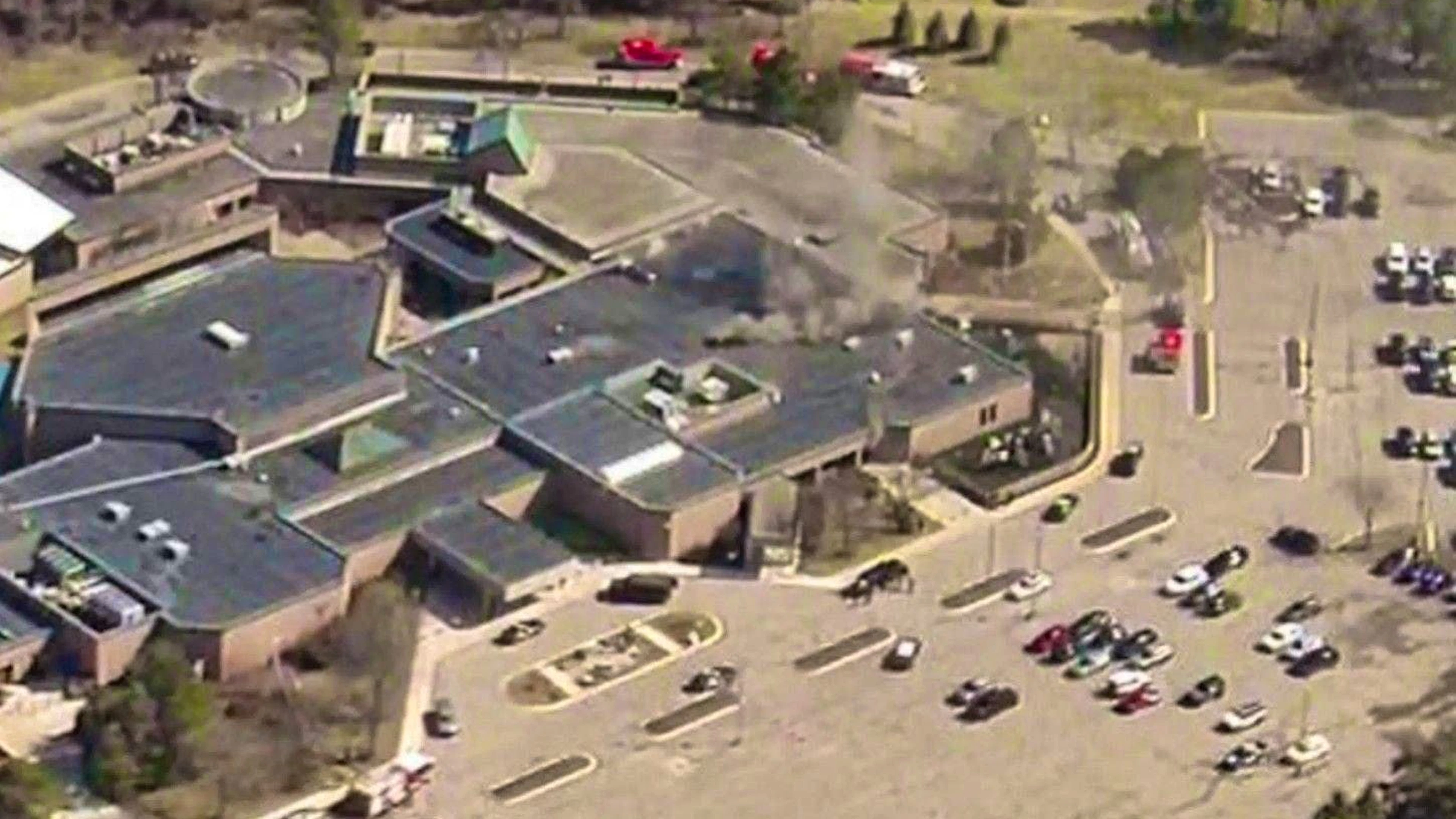 Smoke rose above the building complex of a synagogue near Detroit. Local media reported that an armed attacker had driven a car into the synagogue.