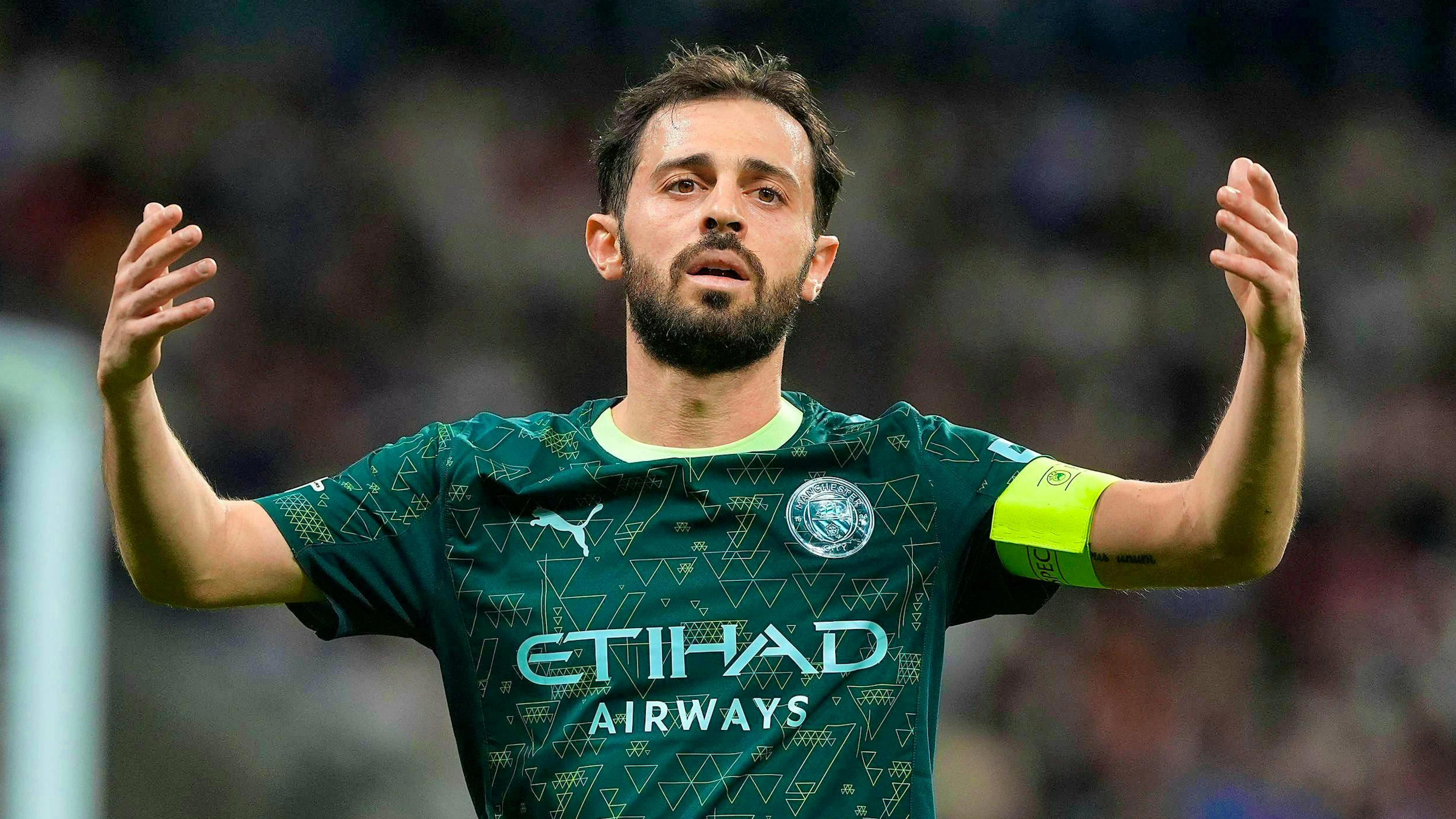 City captain Bernardo Silva throws up his hands.