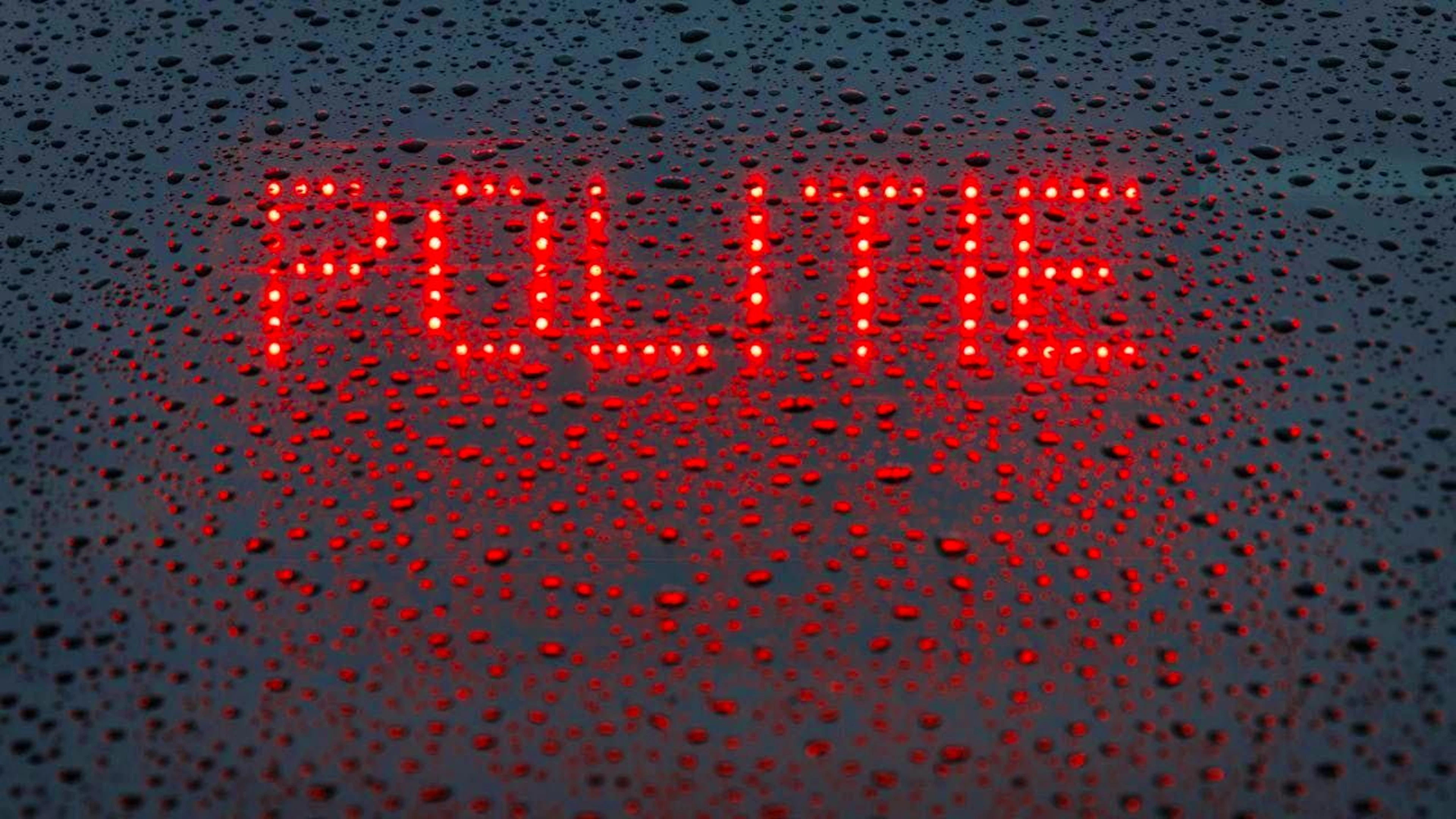 ARCHIVE - The Dutch word "Politie" ("Police") is displayed in the rear window of an emergency vehicle. Photo: Friso Gentsch/dpa