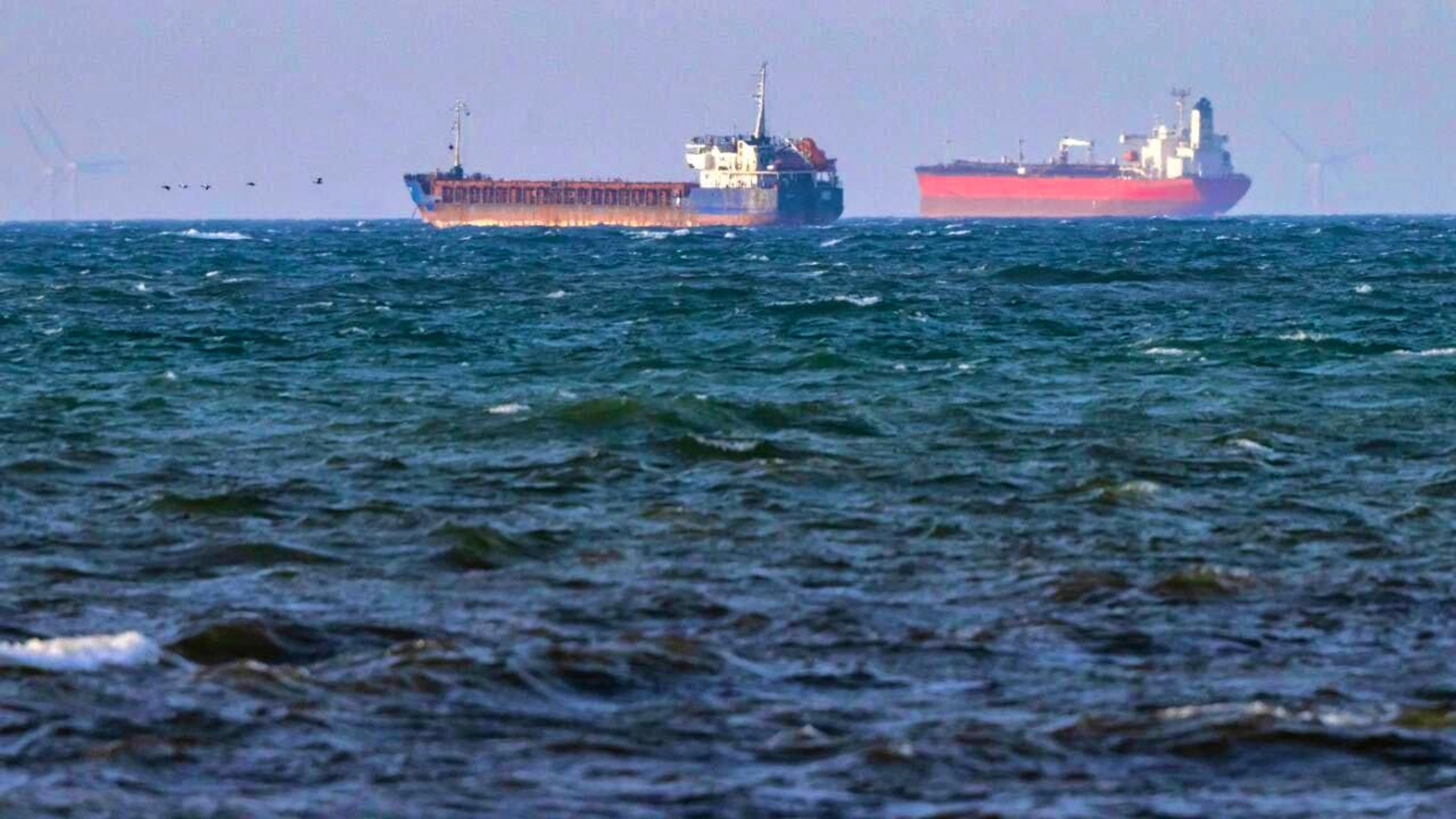 The boarded ships "Caffa" (l) and "Sea Owl I" anchor next to each other off the coast of Sweden. Photo: Johan Nilsson/TT News Agency via AP/dpa - ATTENTION: For editorial use only and only with full attribution of the above credit
