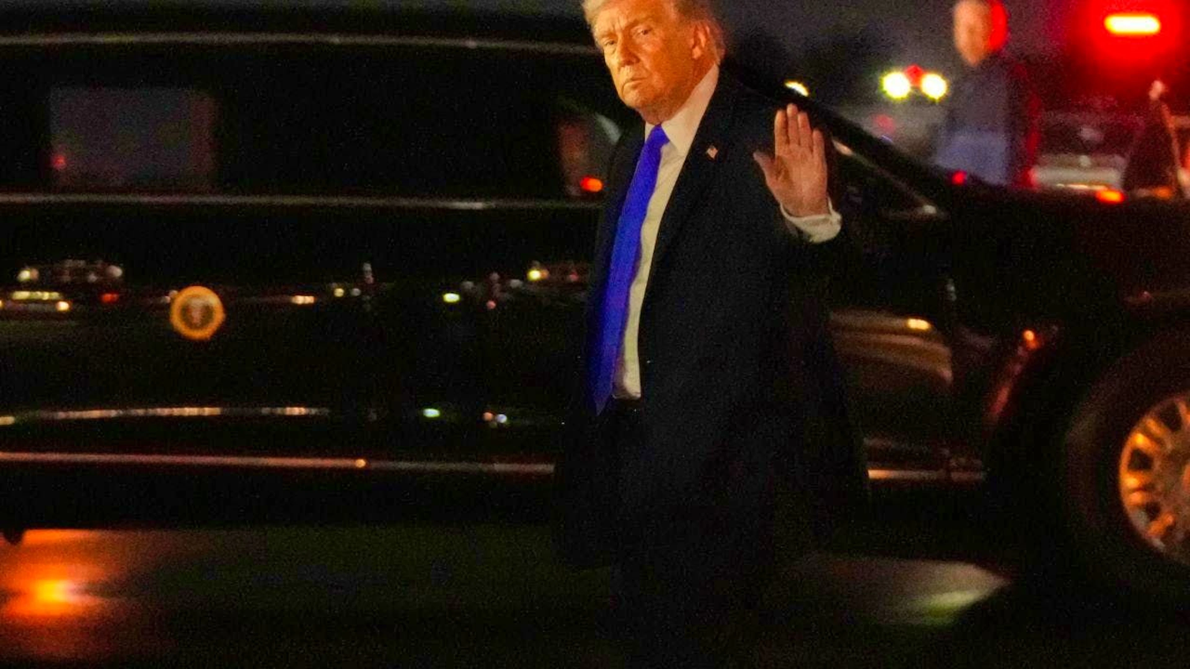 US President Donald Trump waves after his arrival on Air Force One at Palm Beach International Airport. Photo: Mark Schiefelbein/AP/dpa