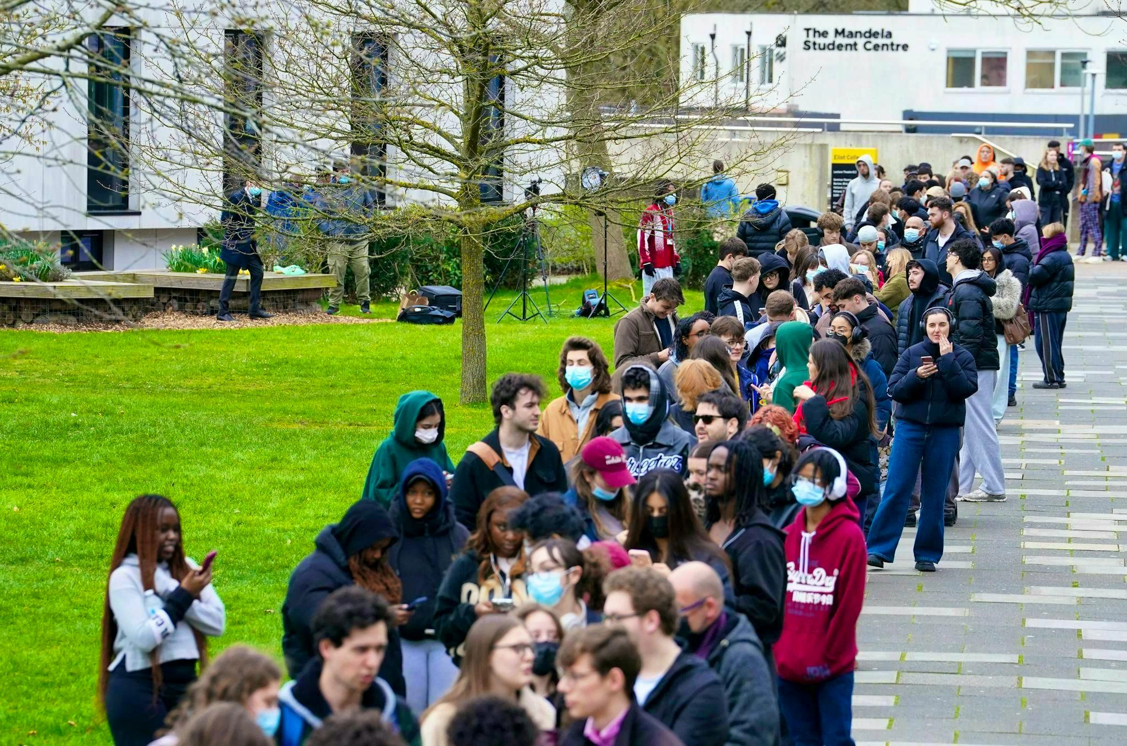 People queue to receive antibiotics as a precaution.
