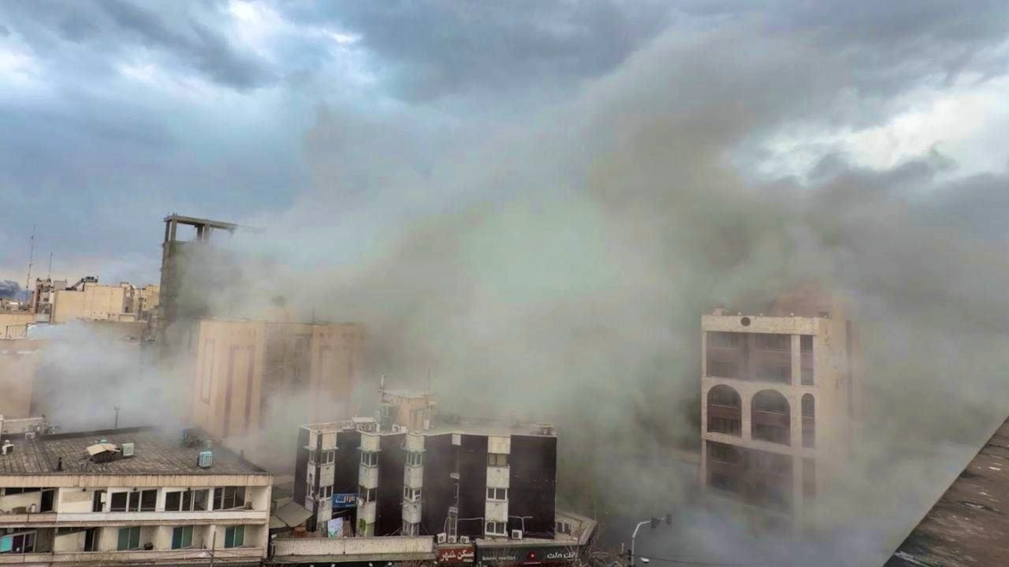 ARCHIVE - A street full of smoke after an explosion in Tehran. Photo: Mohsen Ganji/AP/dpa