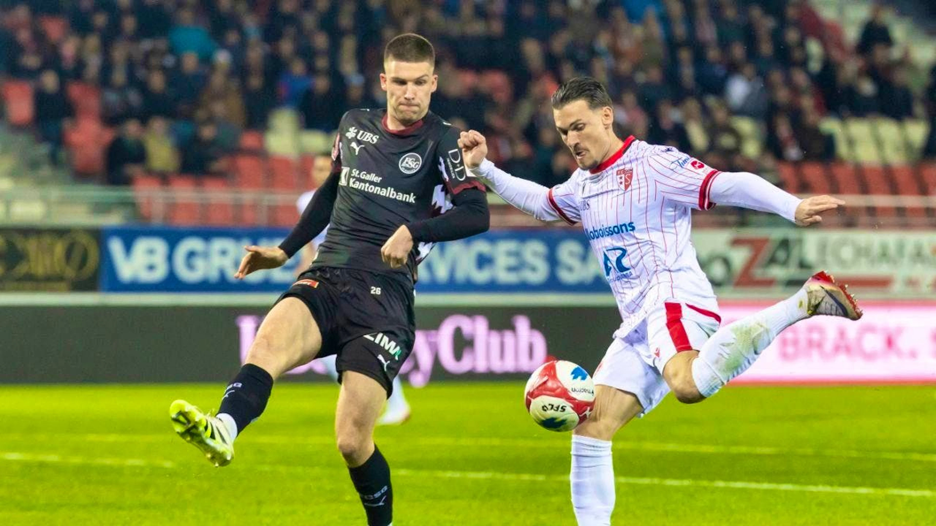 St. Gallen defender Tom Gaal blocks the shot from Sion's Benjamin Kololli