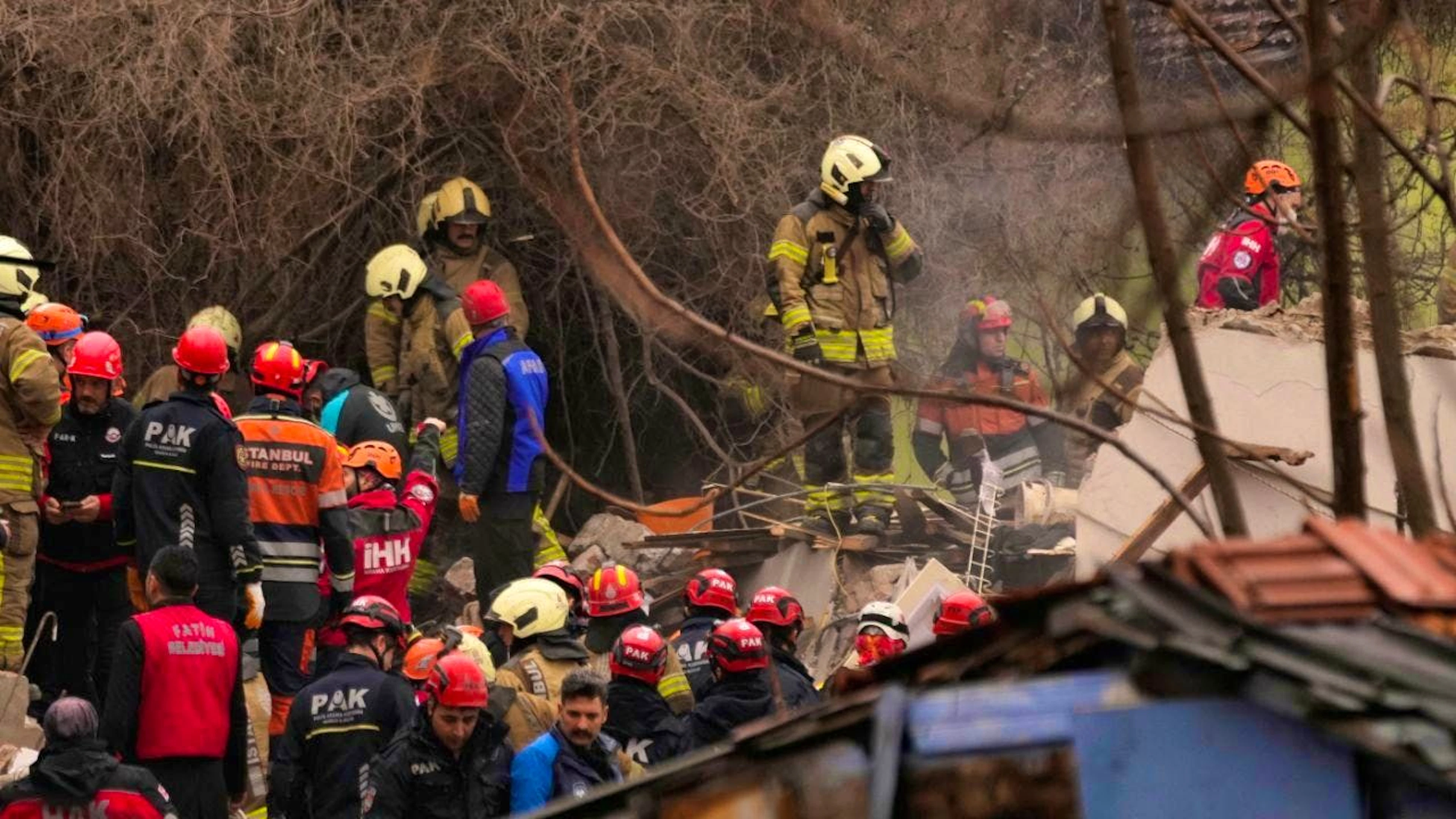 Rescue teams and firefighters search the collapse site of two residential buildings in Istanbul. Photo: Khalil Hamra/AP/dpa