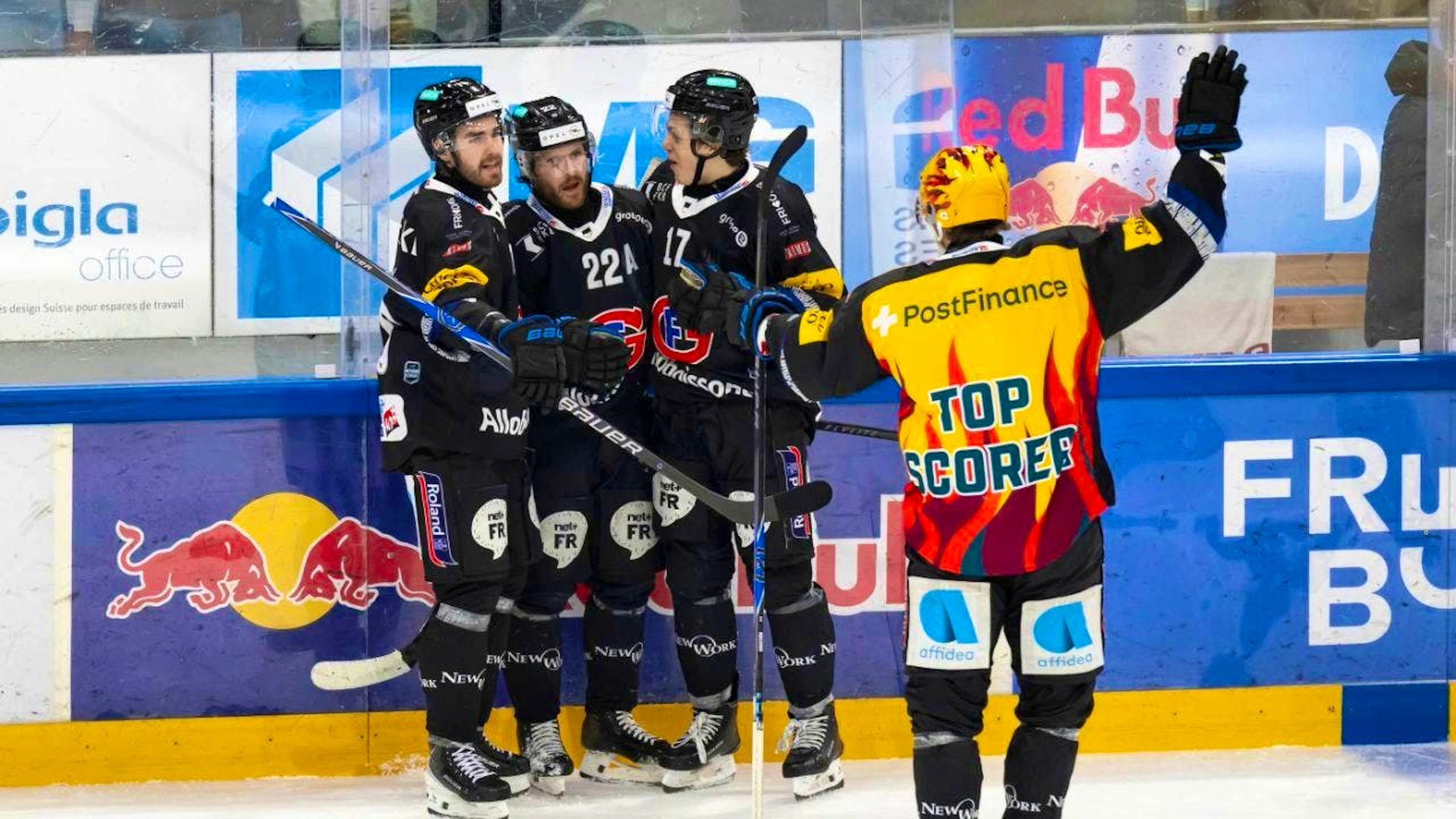 Fribourg's top line of Christoph Bertschy (No. 22) and Attilio Biasca (third from left) scored the first two goals to decide the game
