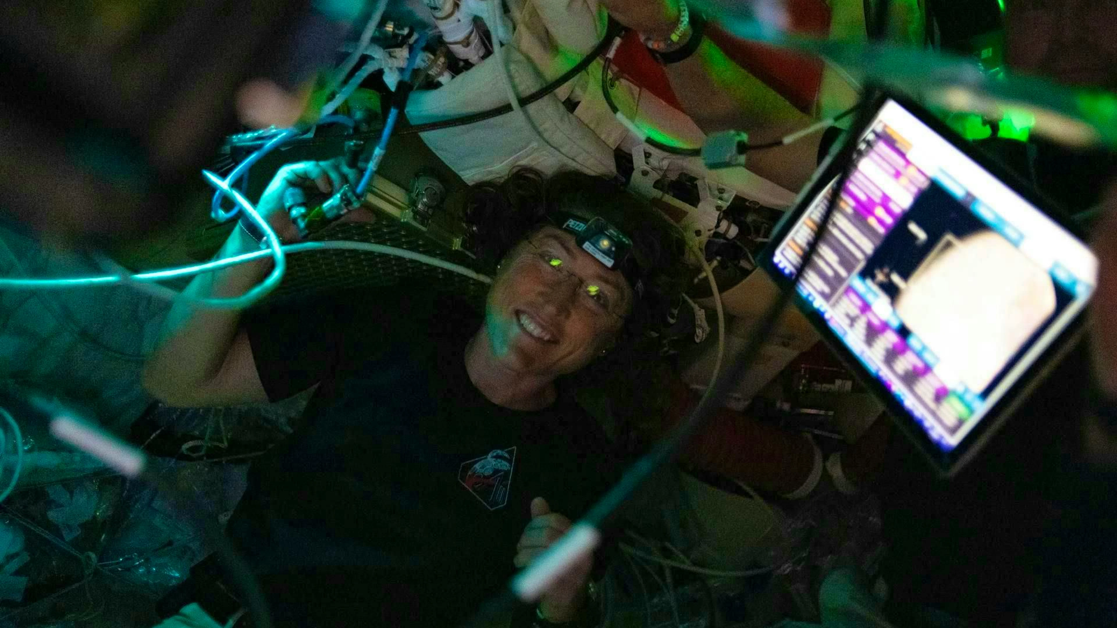 Astronaut Christina Koch is seen here in the Orion spacecraft during Artemis II's flyby of the moon. Koch and her crewmates spent about seven hours taking turns collecting scientific data at Orion's windows to relay to their team on Earth. At the next point, they approached the lunar surface to within 6540 kilometers.