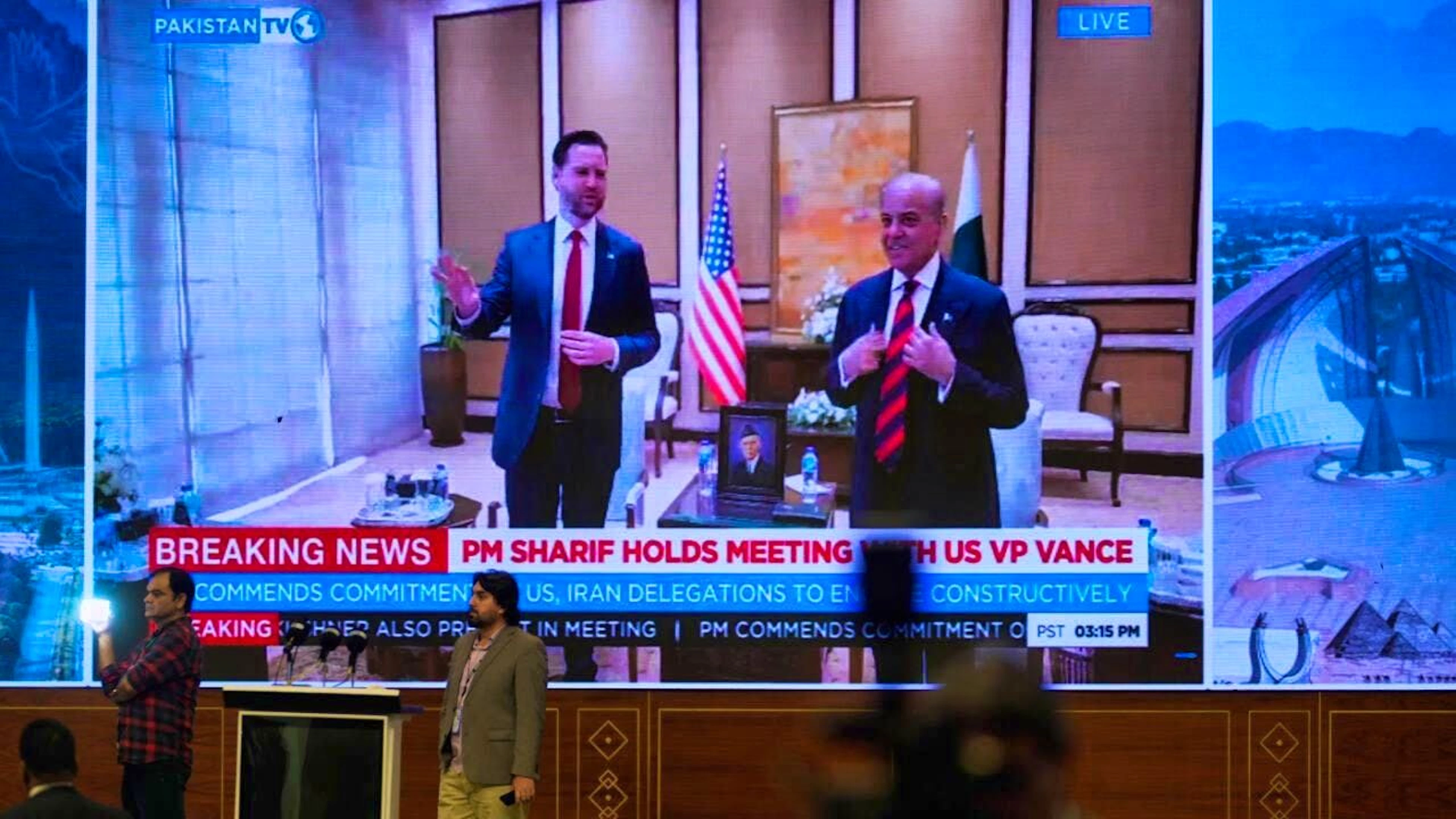 Journalists work as Pakistani state television broadcasts the meeting between US Vice President J.D. Vance and Pakistani Prime Minister Shehbaz Sharif at a media center for coverage of the US-Iran talks in Islamabad. Photo: Anjum Naveed/AP/dpa