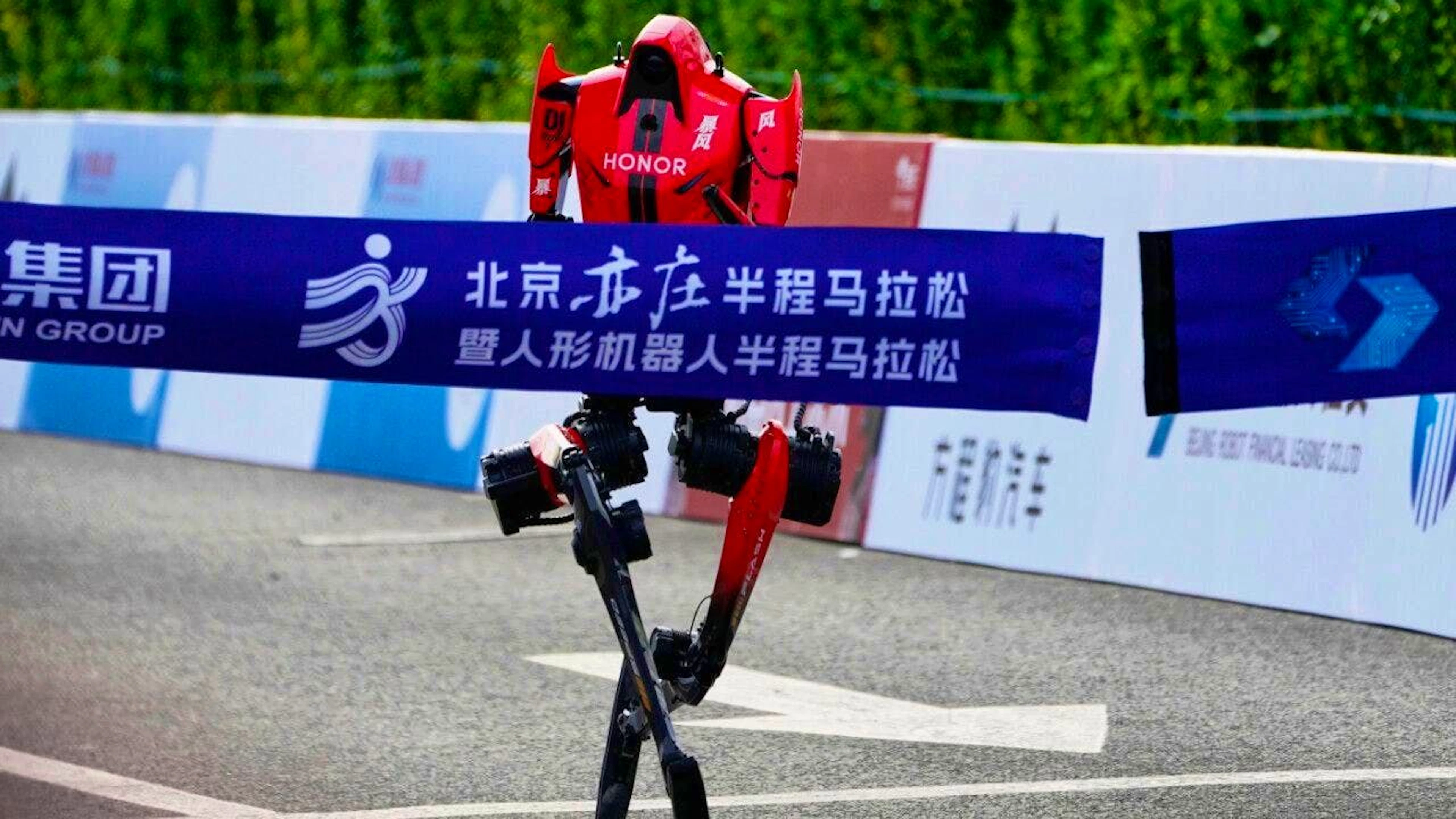 A robot crosses the finish line of the Beijing E-Town Half Marathon and Humanoid Robot Half Marathon, which takes place in the outskirts of Beijing.
