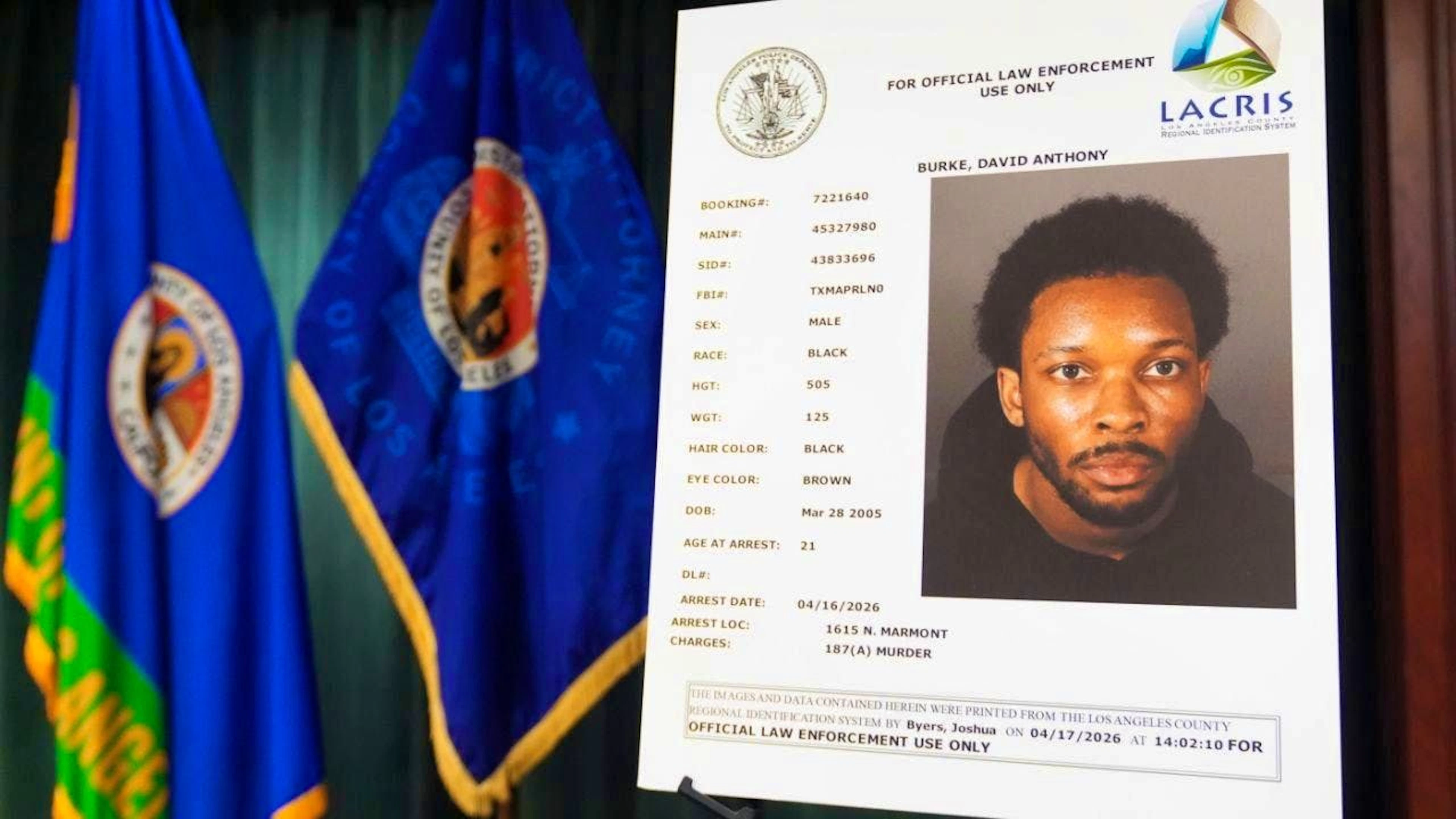 A mugshot of David Anthony Burke, who performs under the stage name D4vd, is shown at a press conference. Photo: Damian Dovarganes/AP/dpa
