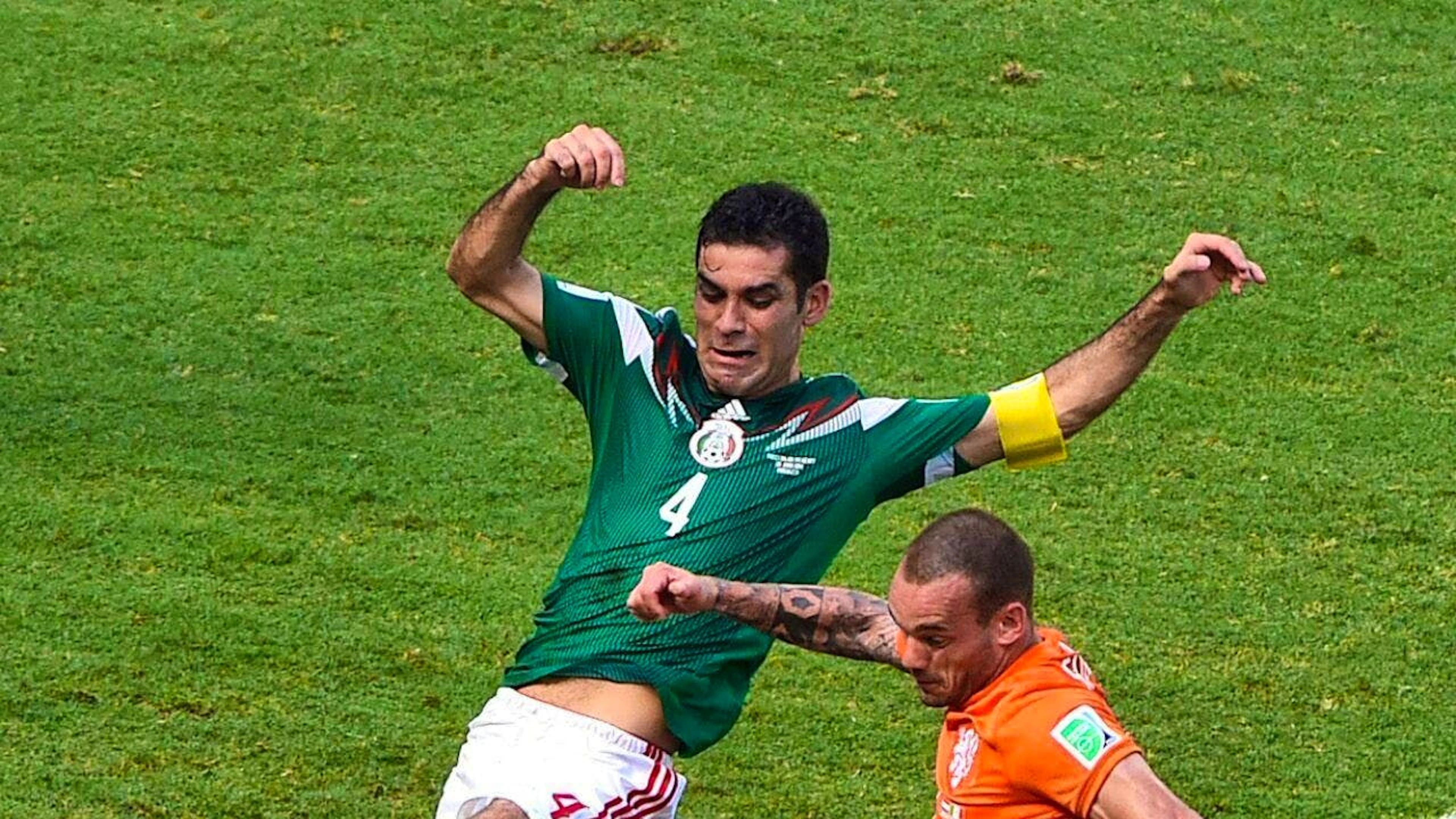 Mexico's Rafael Marquez (left) with the captain's armband at the 2014 World Cup