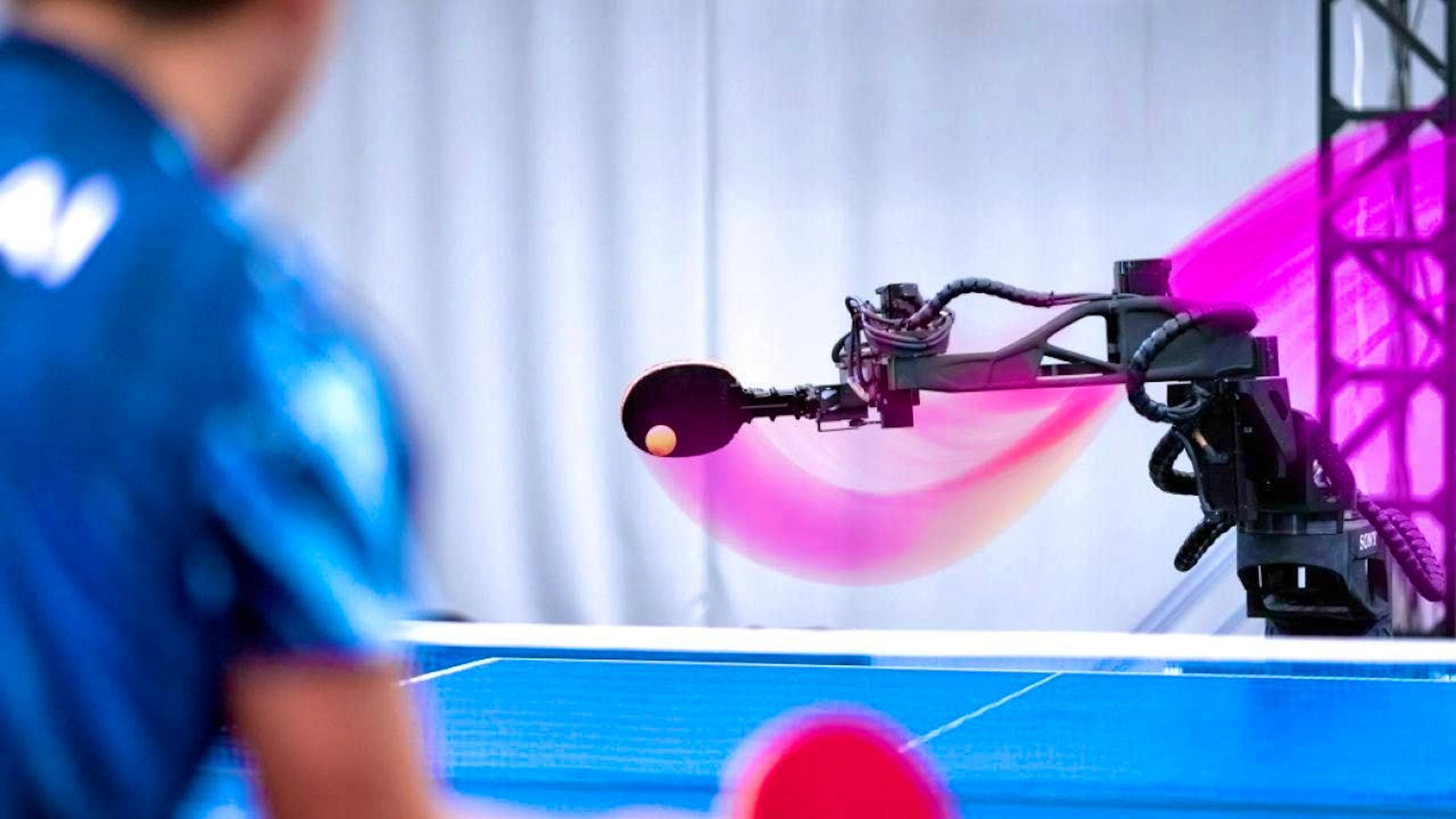 The new robot "Ace" plays against Japanese table tennis champion Yamato Kawamata.