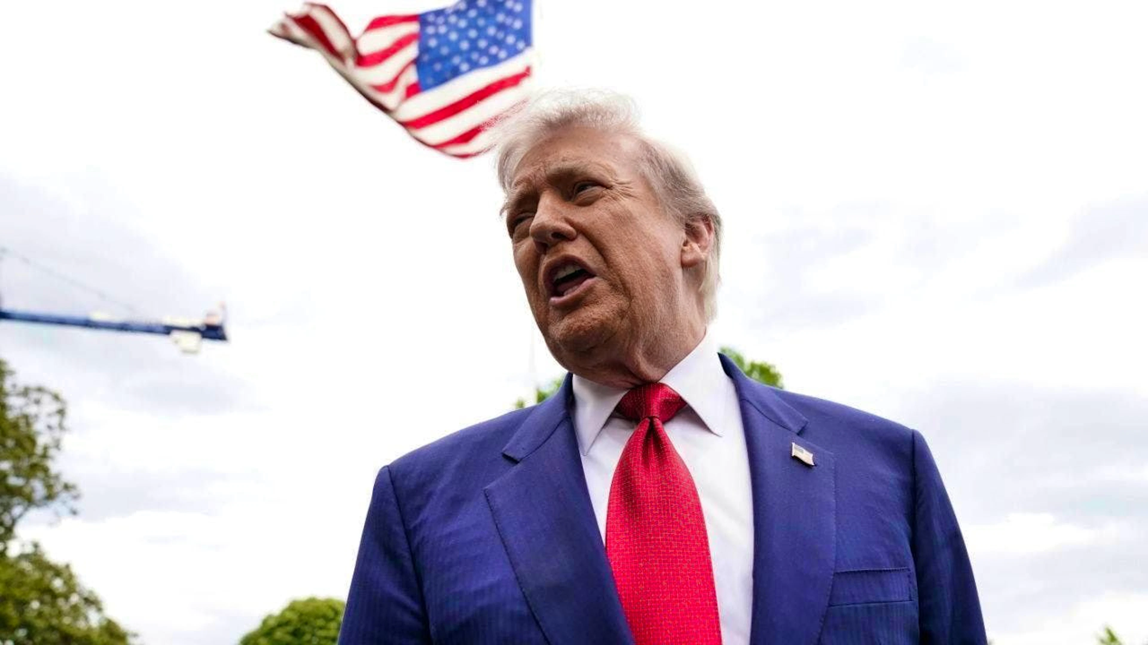 US President Donald Trump speaks to reporters before walking to Marine One on the South Lawn of the White House. Photo: Jose Luis Magana/AP/dpa