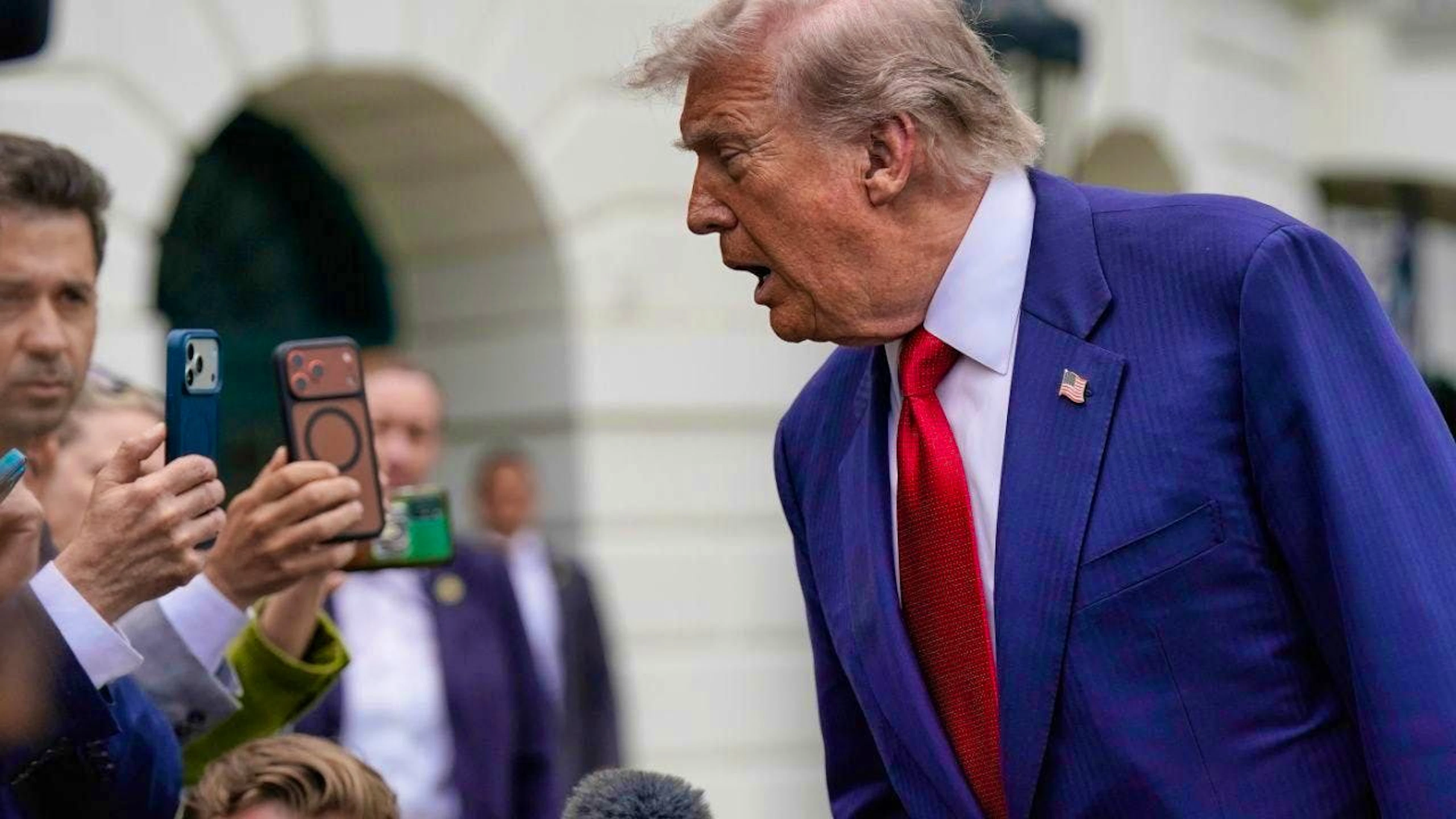 US President Donald Trump speaks to reporters before walking to Marine One on the South Lawn of the White House. Photo: Jose Luis Magana/AP/dpa
