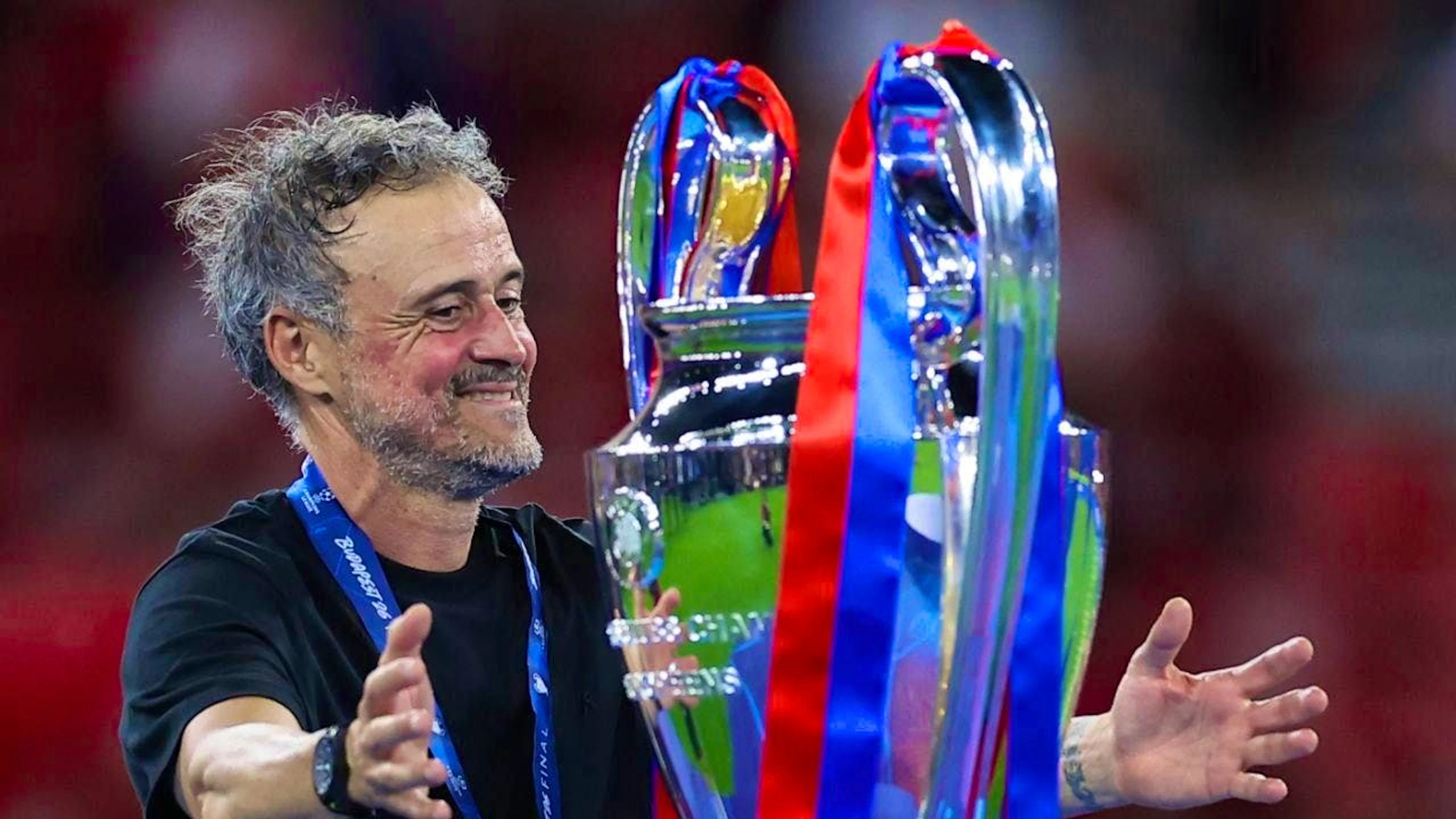 Successful PSG coach Luis Enrique and the Champions League trophy