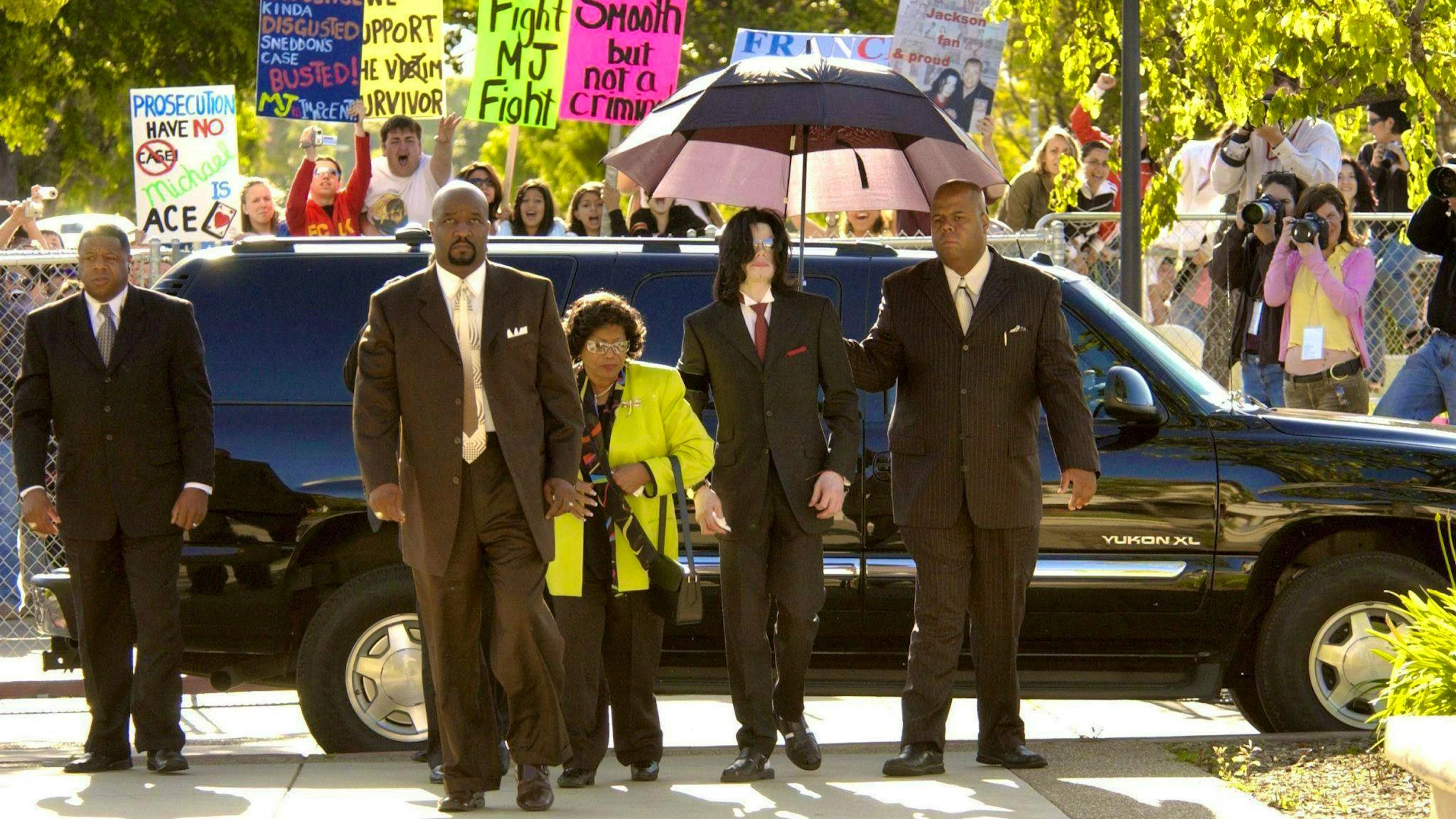 Michael Jackson arrives at the courthouse in Santa Maria, California, in 2005. Numerous fans gather to support the pop star during the abuse trial.