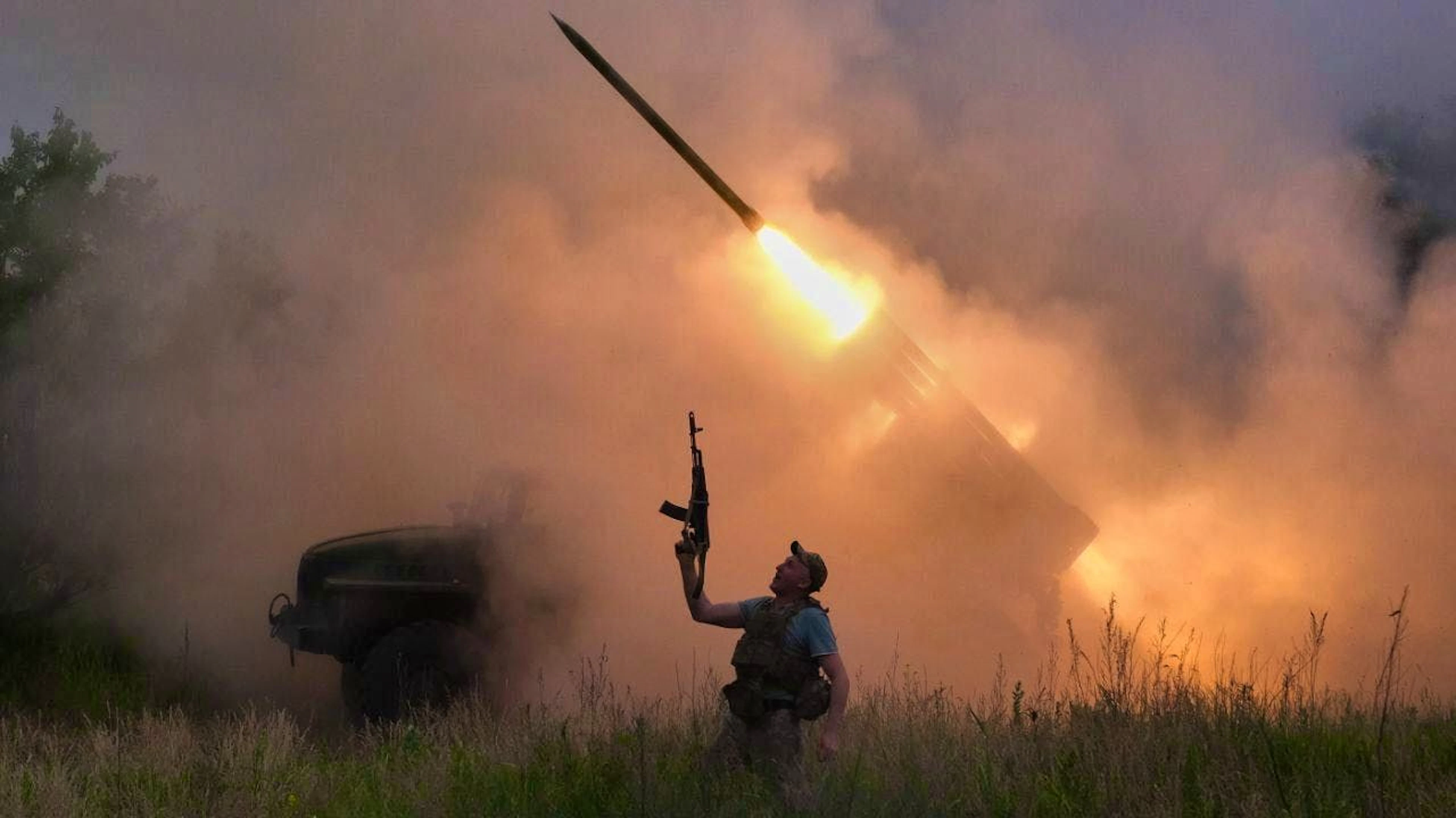 HANDOUT - In this photo provided by the press service of Ukraine's 93rd Kholodnyi Yar Separate Mechanized Brigade, a soldier reacts as an MRLS BM-21 "Grad" fires at Russian positions near Kostiantynivka. Photo: Iryna Rybakova/Ukrainian 93rd Mechanized brigade/AP/dpa - ATTENTION: For editorial use only in connection with current reporting and only with full attribution to the above credit