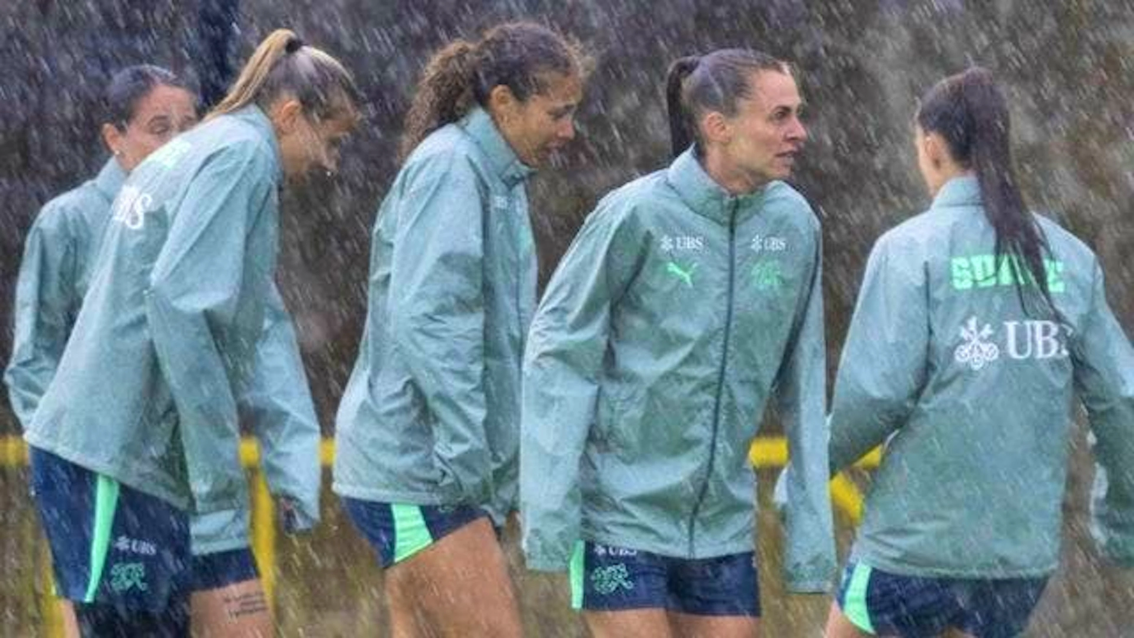 Not for fair-weather footballers: The women's national team's final training session.