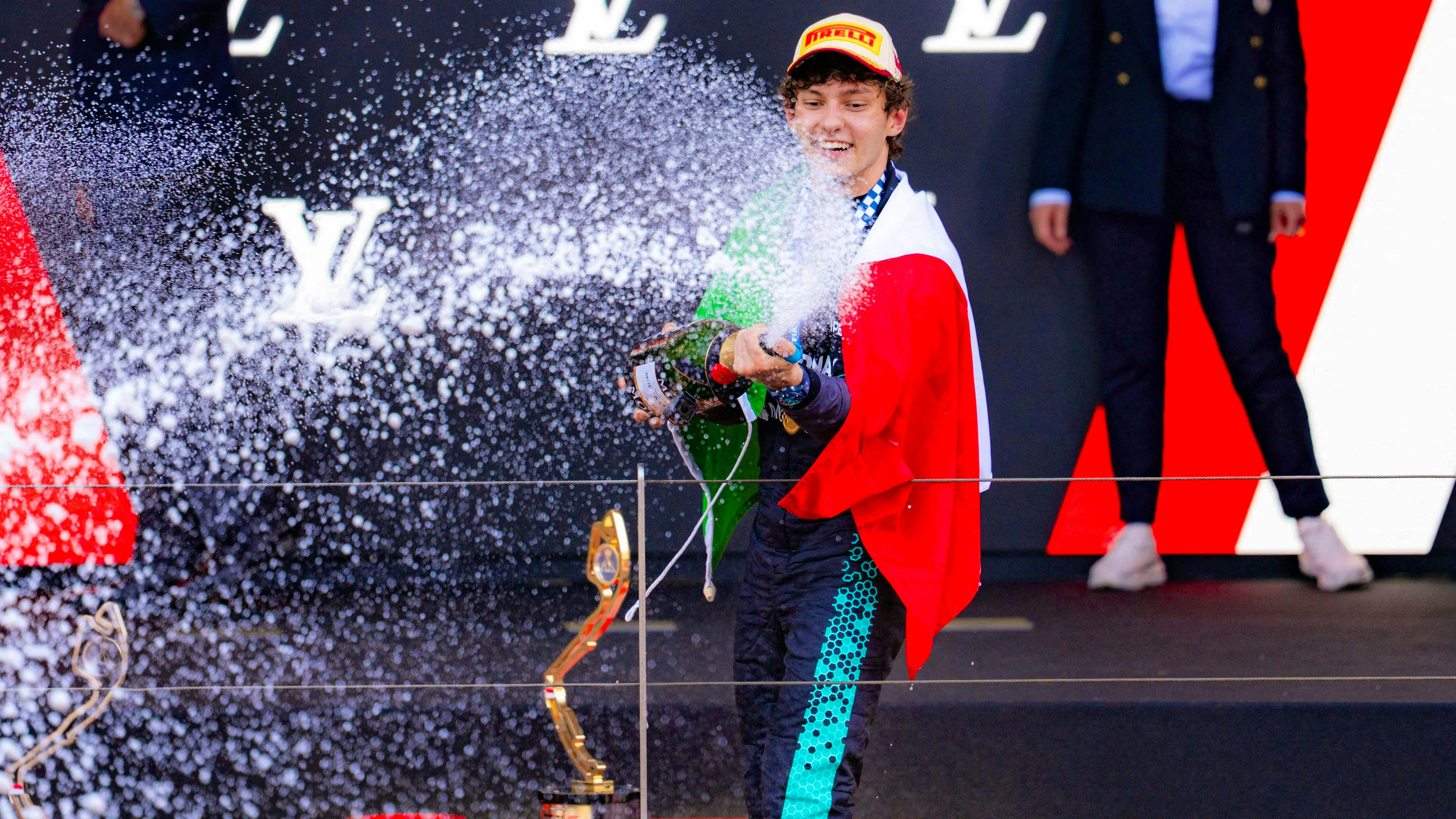 Champagne shower for winner Antonelli.