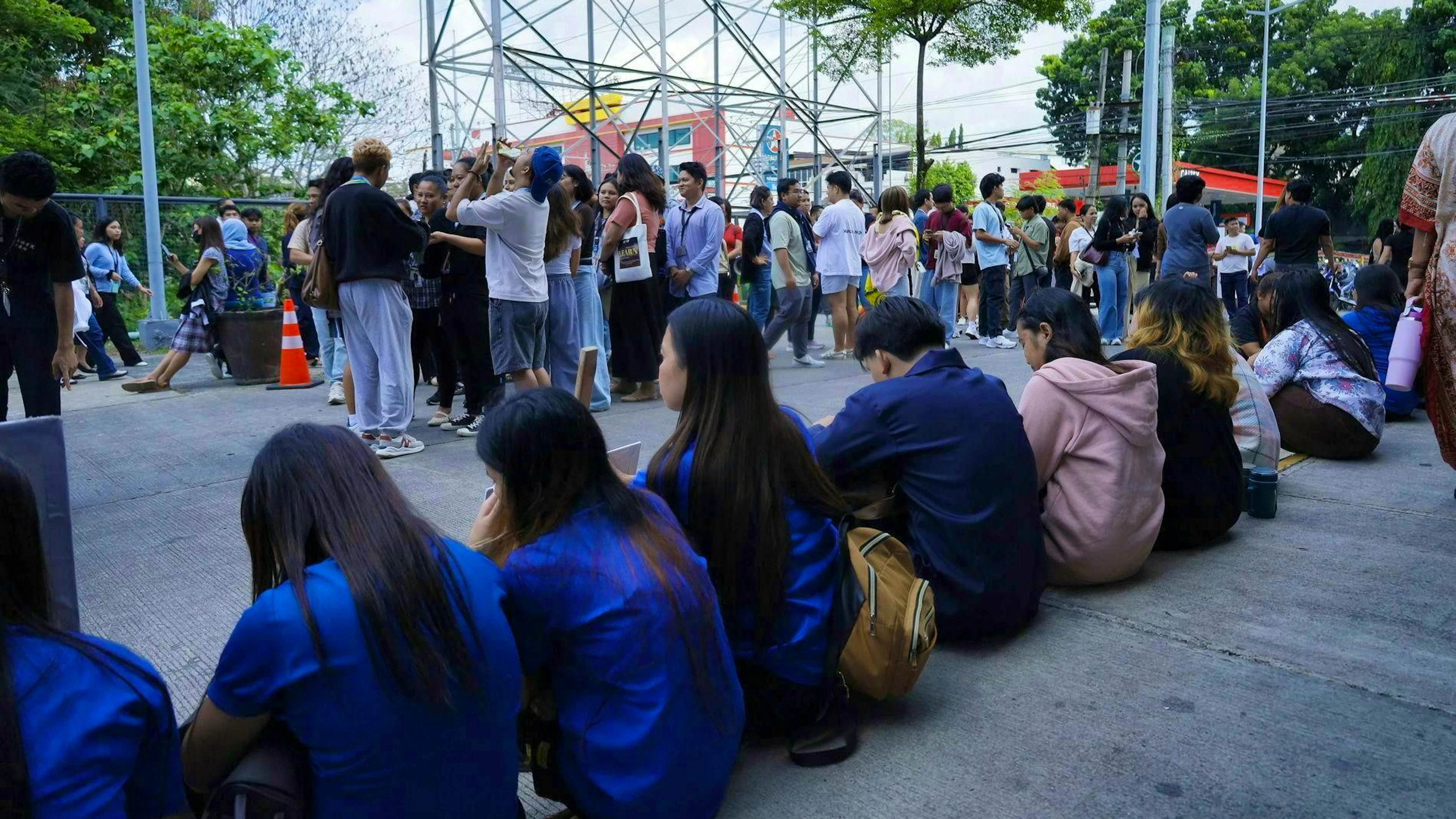 People in Davao City gather outside after the earthquake.