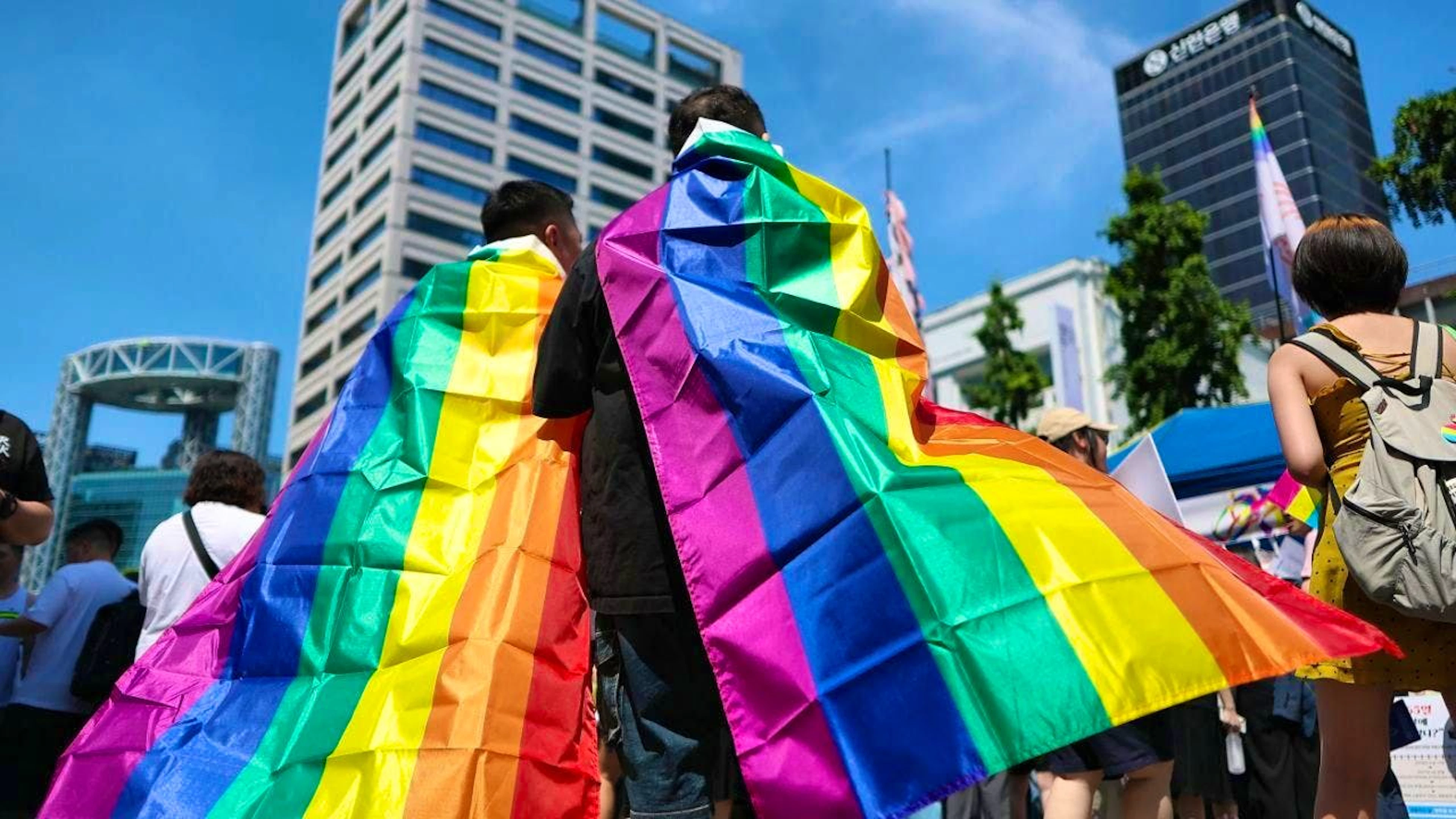Participants in the Seoul Queer Culture Festival are draped in rainbow flags. Photo: -/YNA/dpa