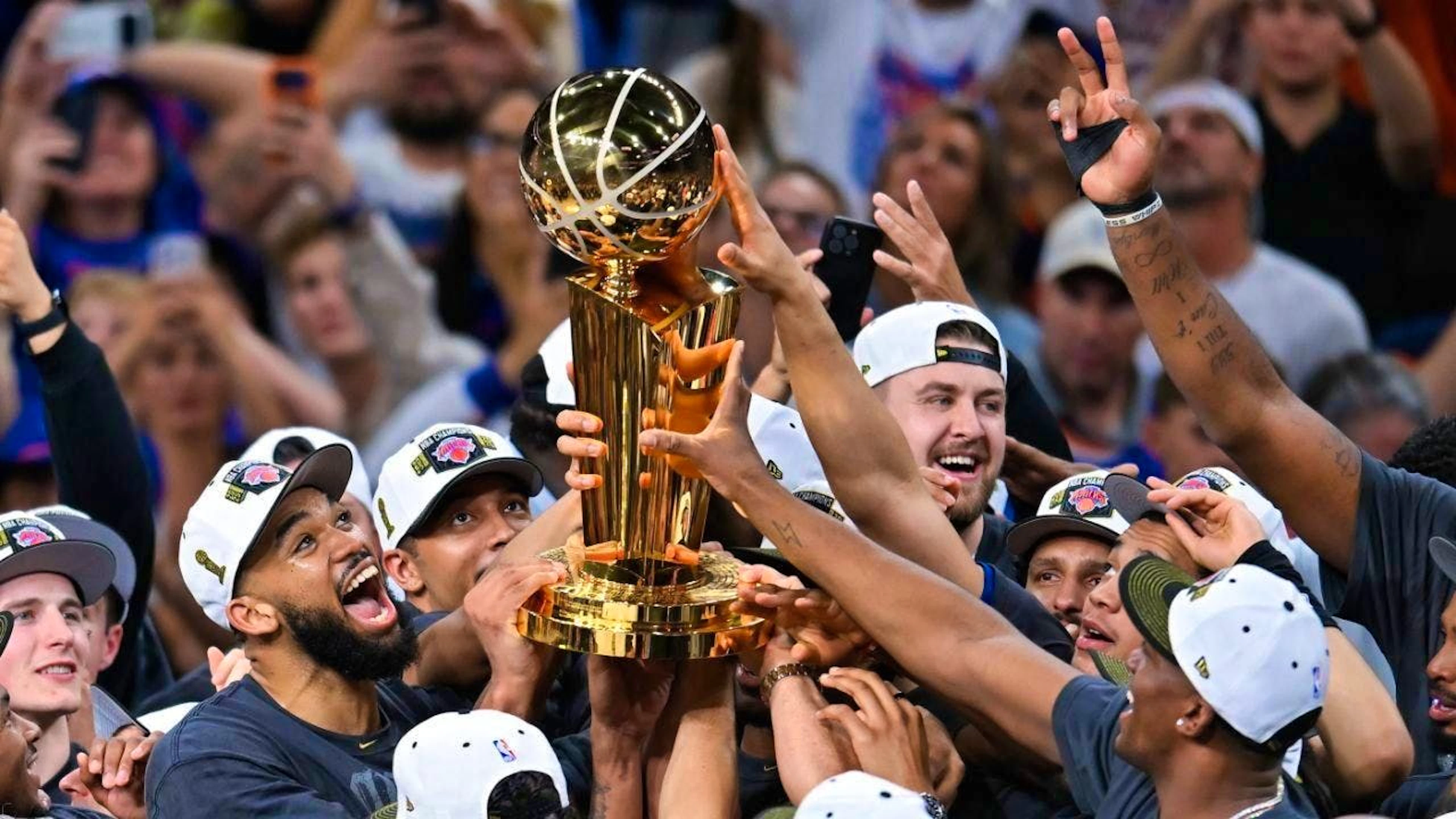 The New York Knicks win the NBA trophy for the third time